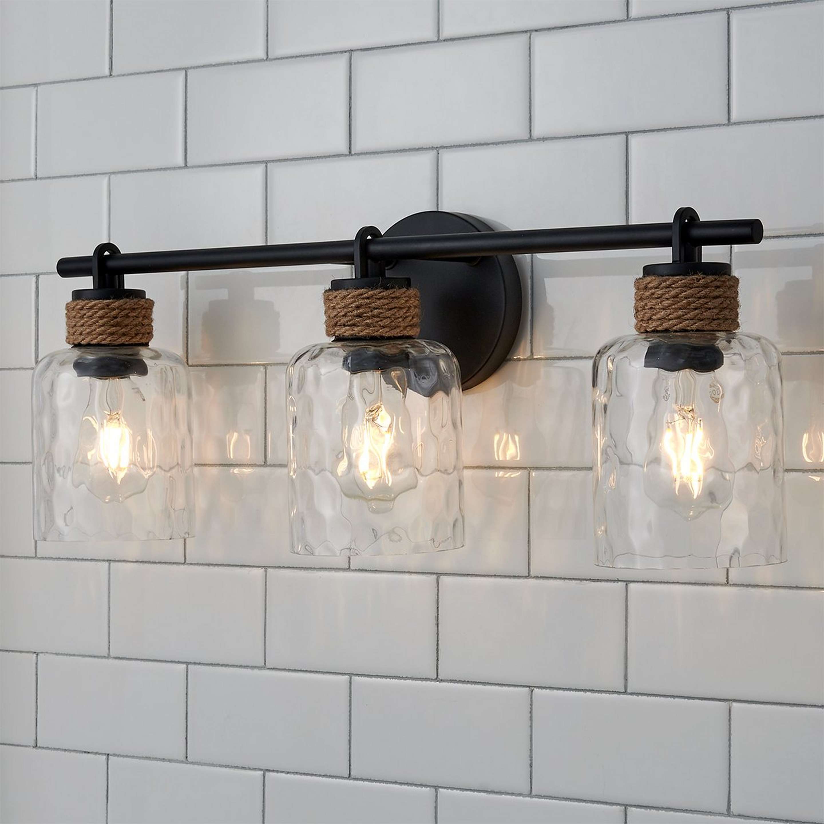 A Samuel Vanity Light - 3 Light with Matte Black / Natural Rope / Clear Water Glass color