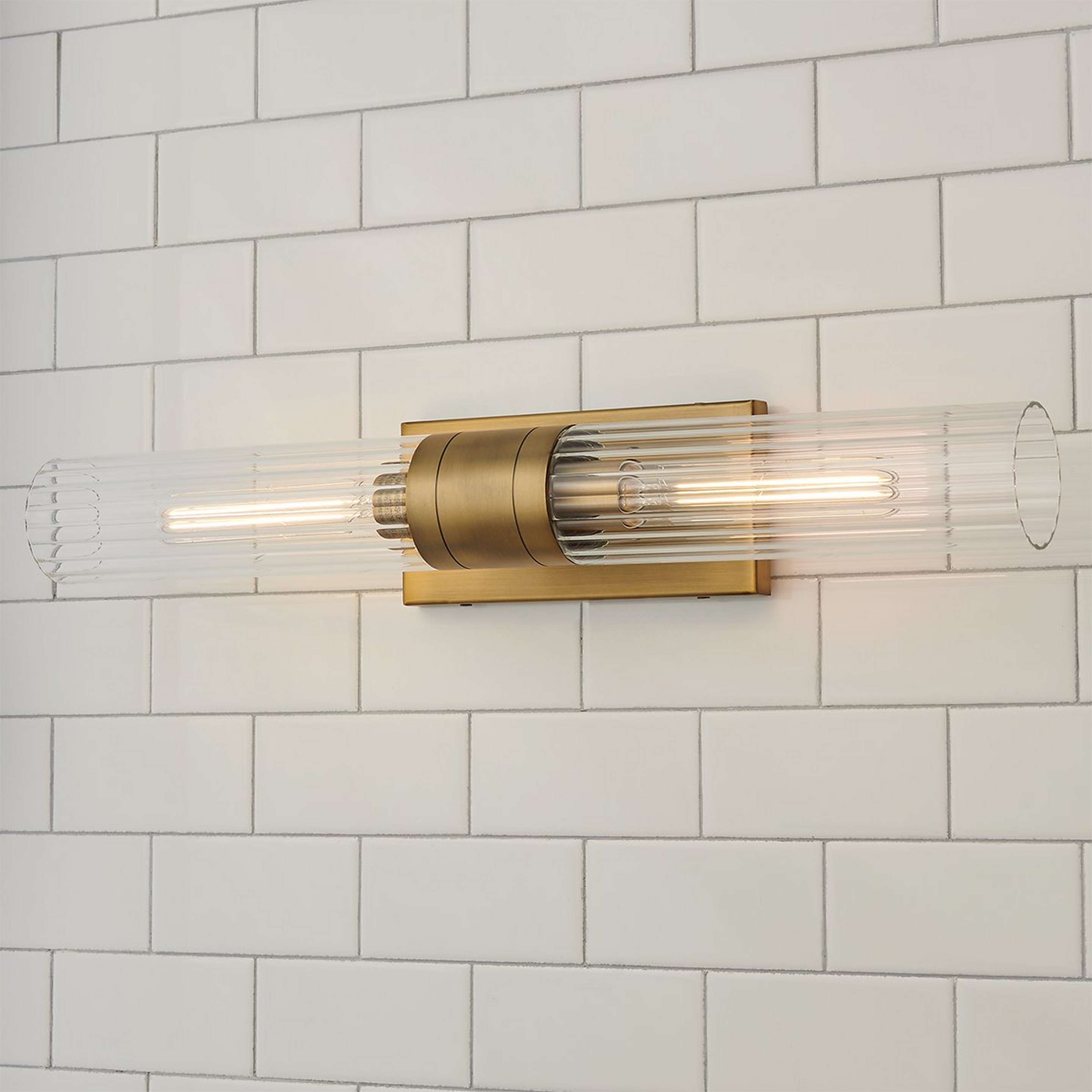 A Malika Clear Glass Bath Sconce - 2 Light with Brushed Brass / Clear Glass color