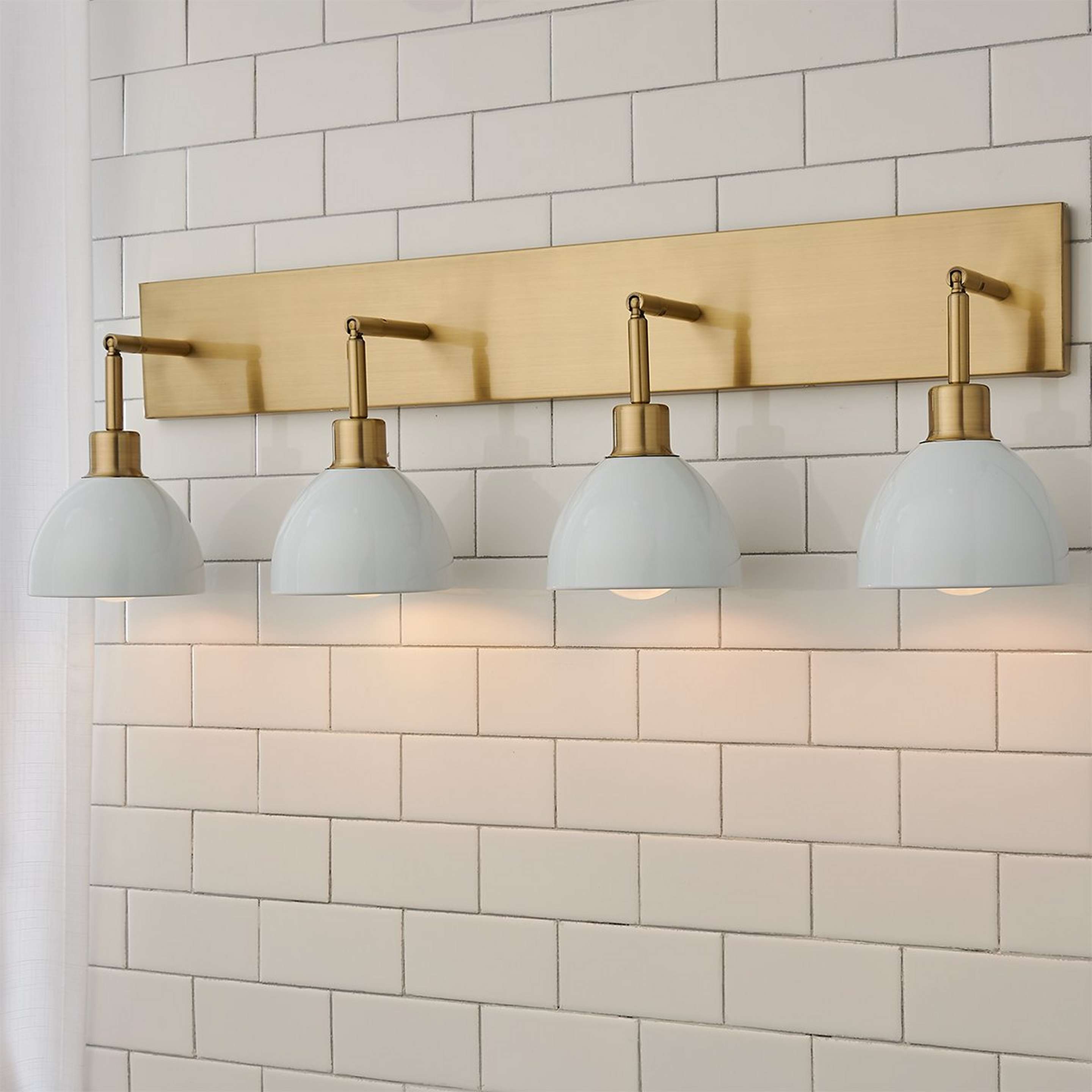 A Young House Love Dapper Vanity Light - 4 Light with Brushed Brass / White color