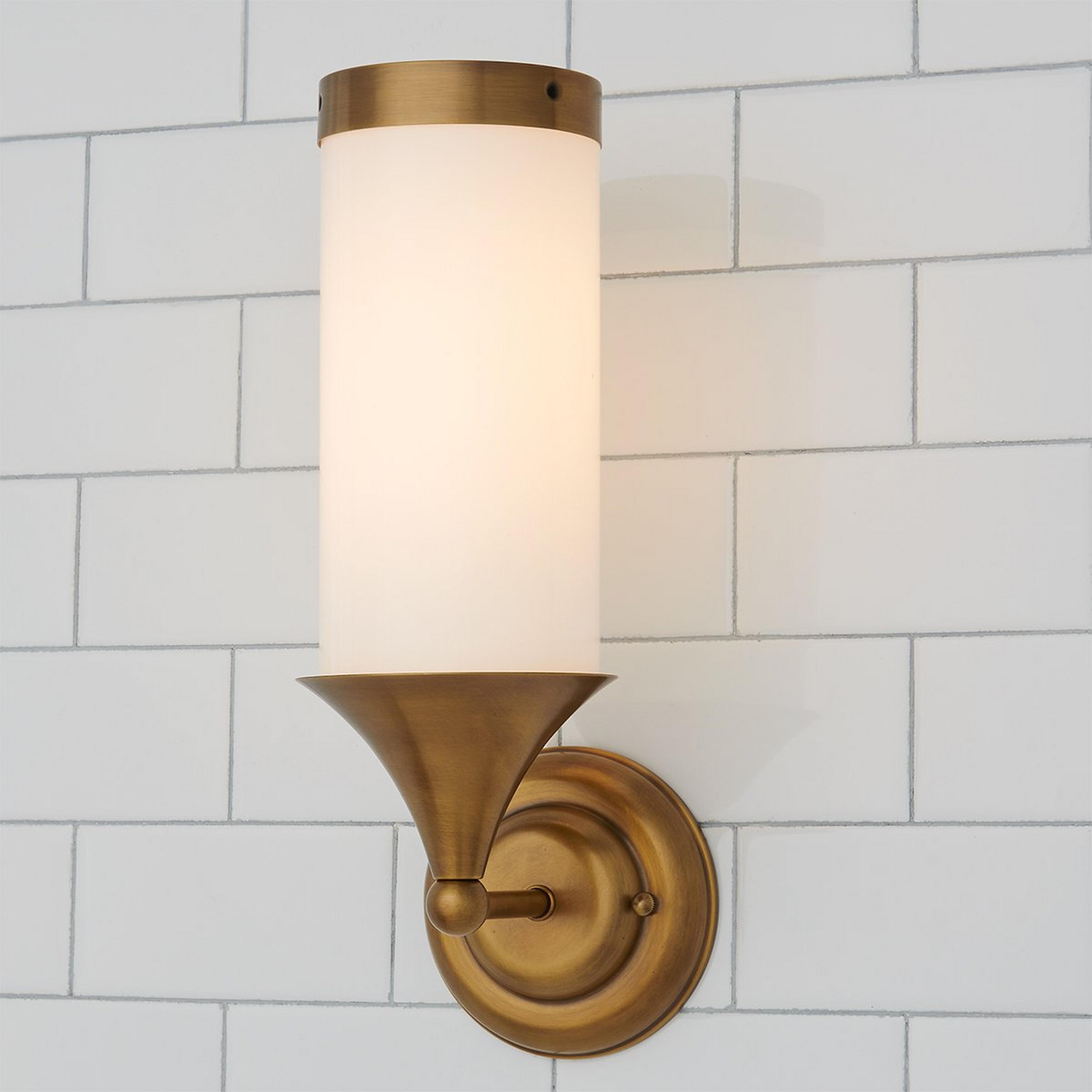 A Erin & Ben Co. Flatiron Bath Sconce with Satin Brass color
