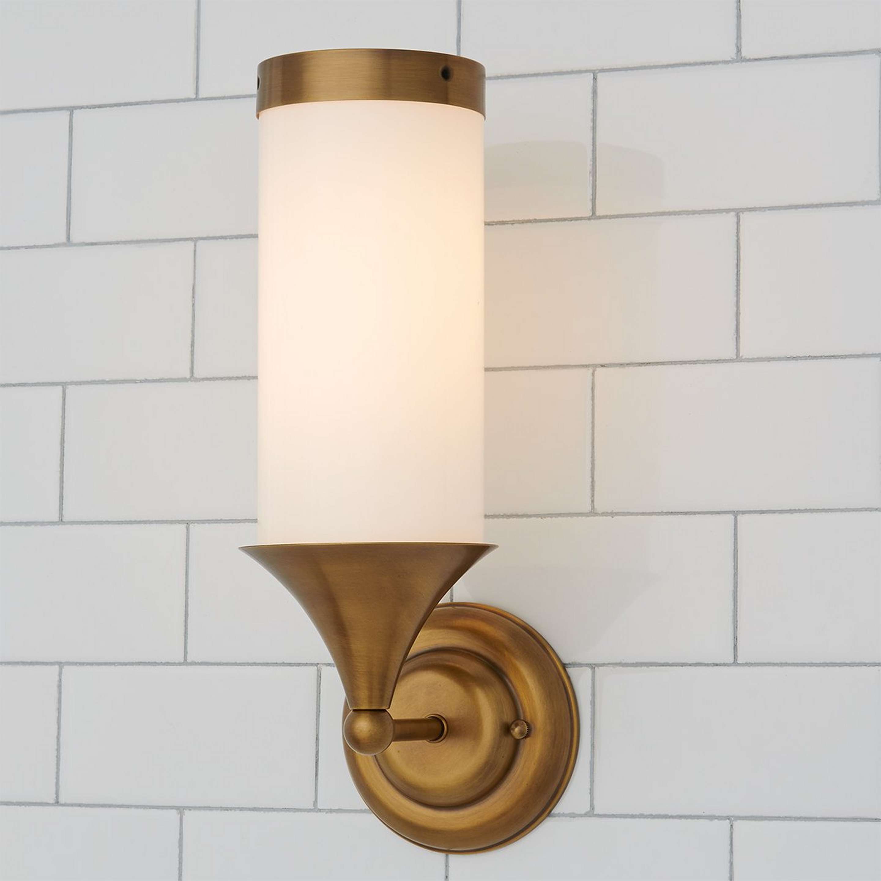 A Erin & Ben Co. Flatiron Bath Sconce with Satin Brass color
