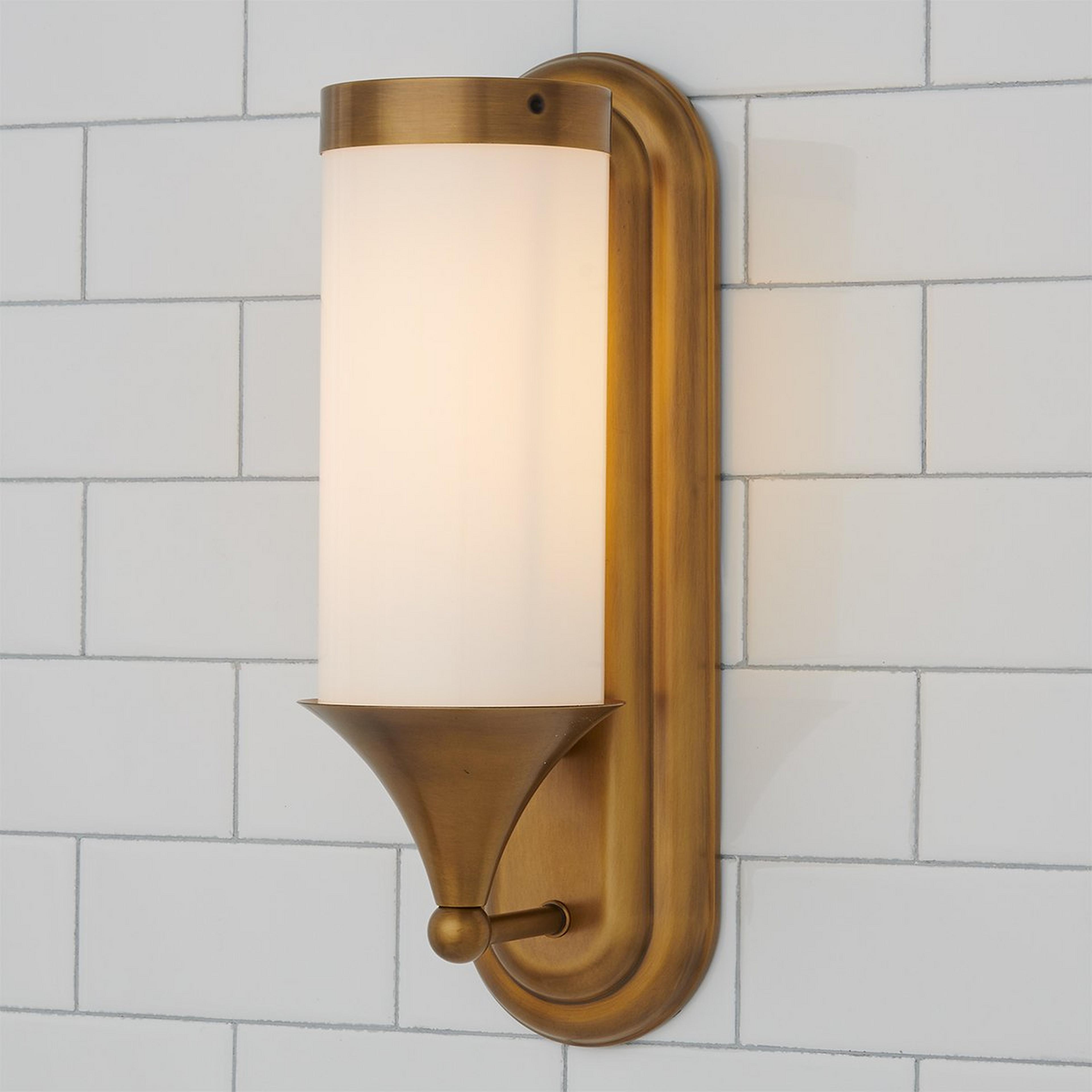 A Erin & Ben Co. Flatiron Tall Bath Sconce with Satin Brass color