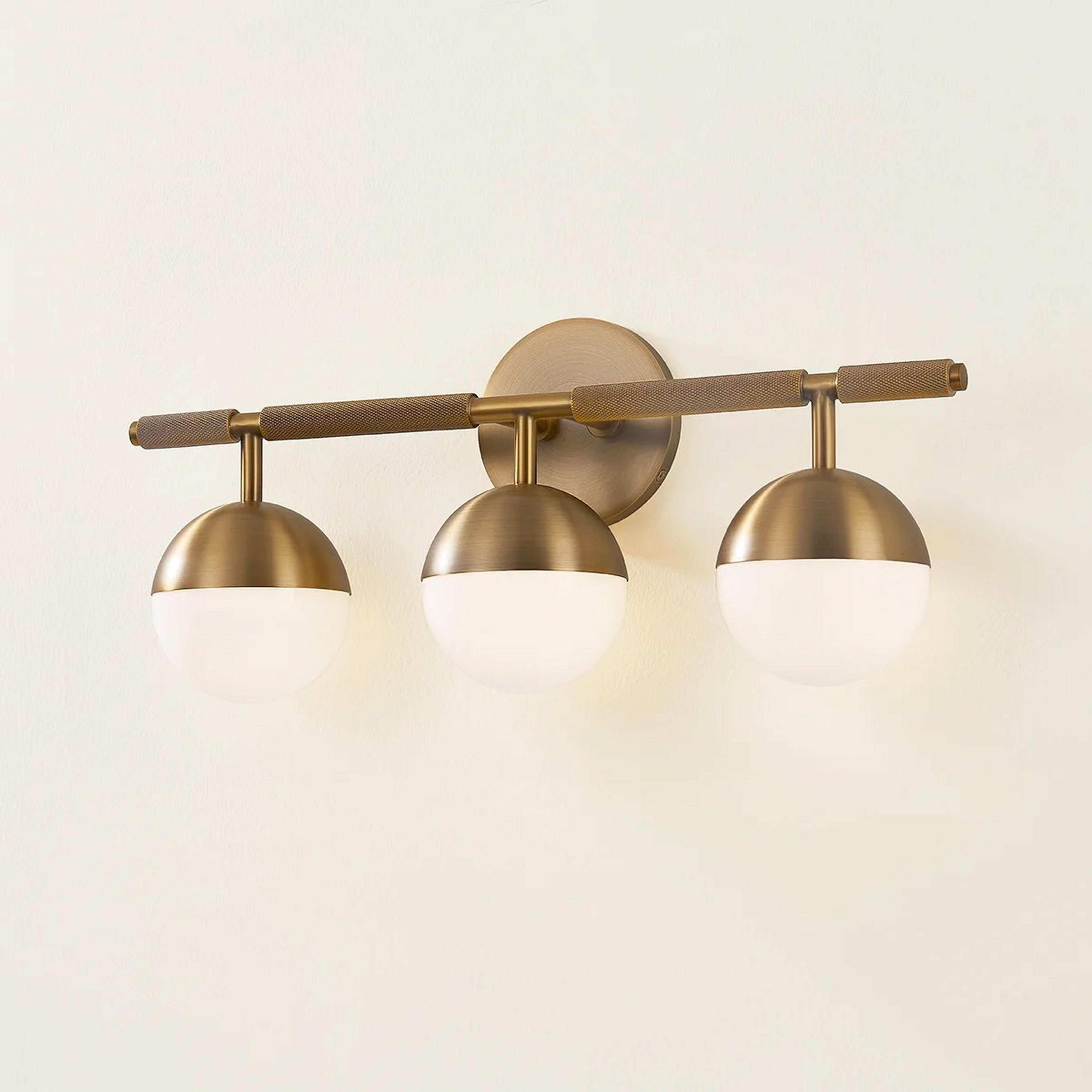A Amadora Vanity Light - 3 Light with Brass / White Glass color