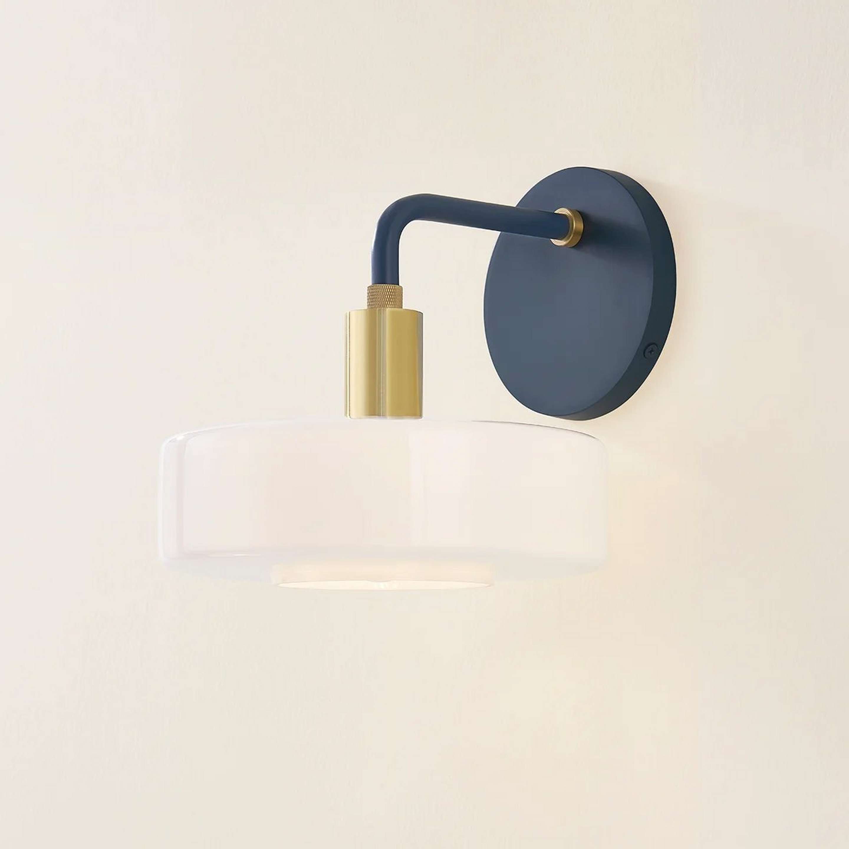 A Nikola Bath Sconce with Brass / Slate Blue / White Glass color