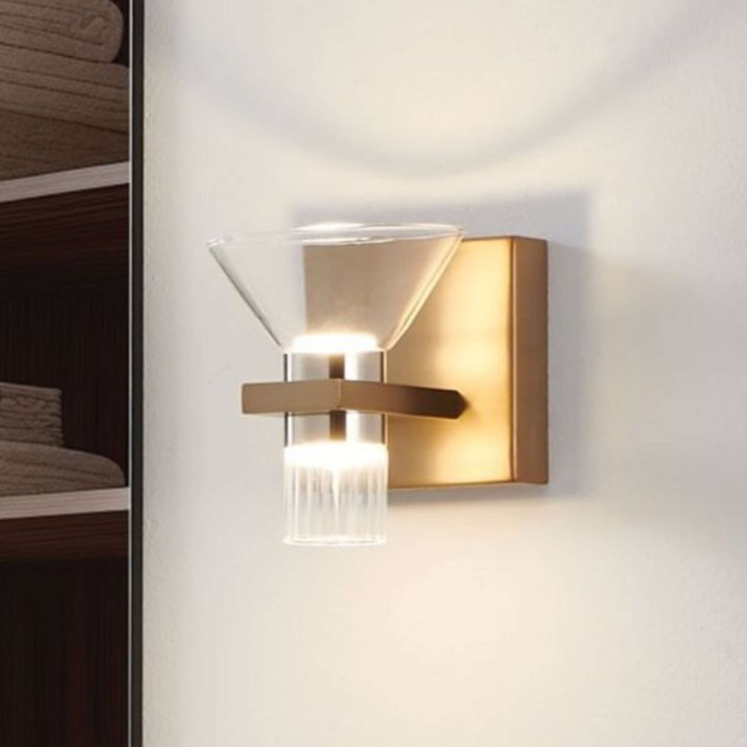 A Martinez LED Bath Sconce with Brass / Nickel / Clear Glass color