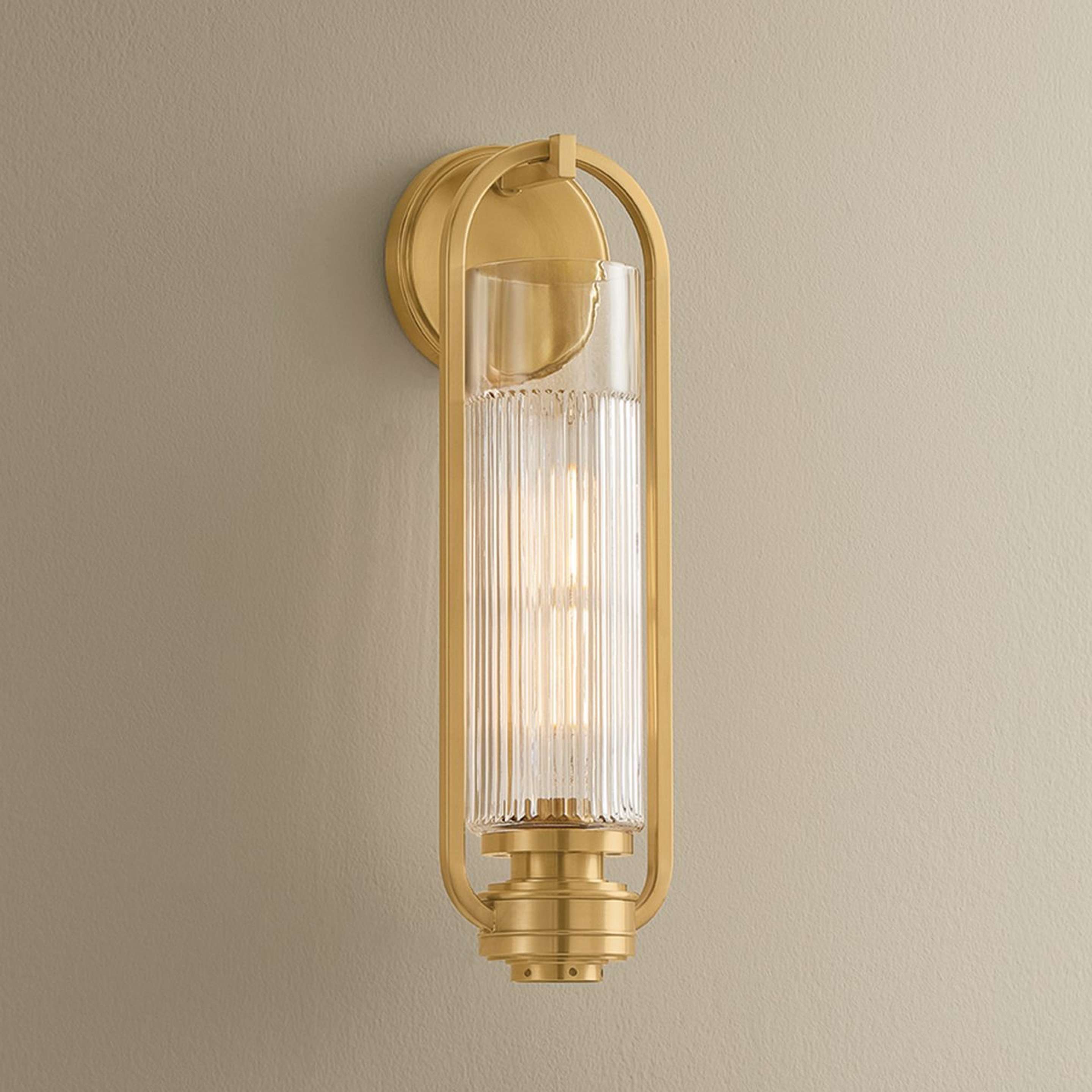 A Nightwatch Sconce with Brass / Clear Glass color