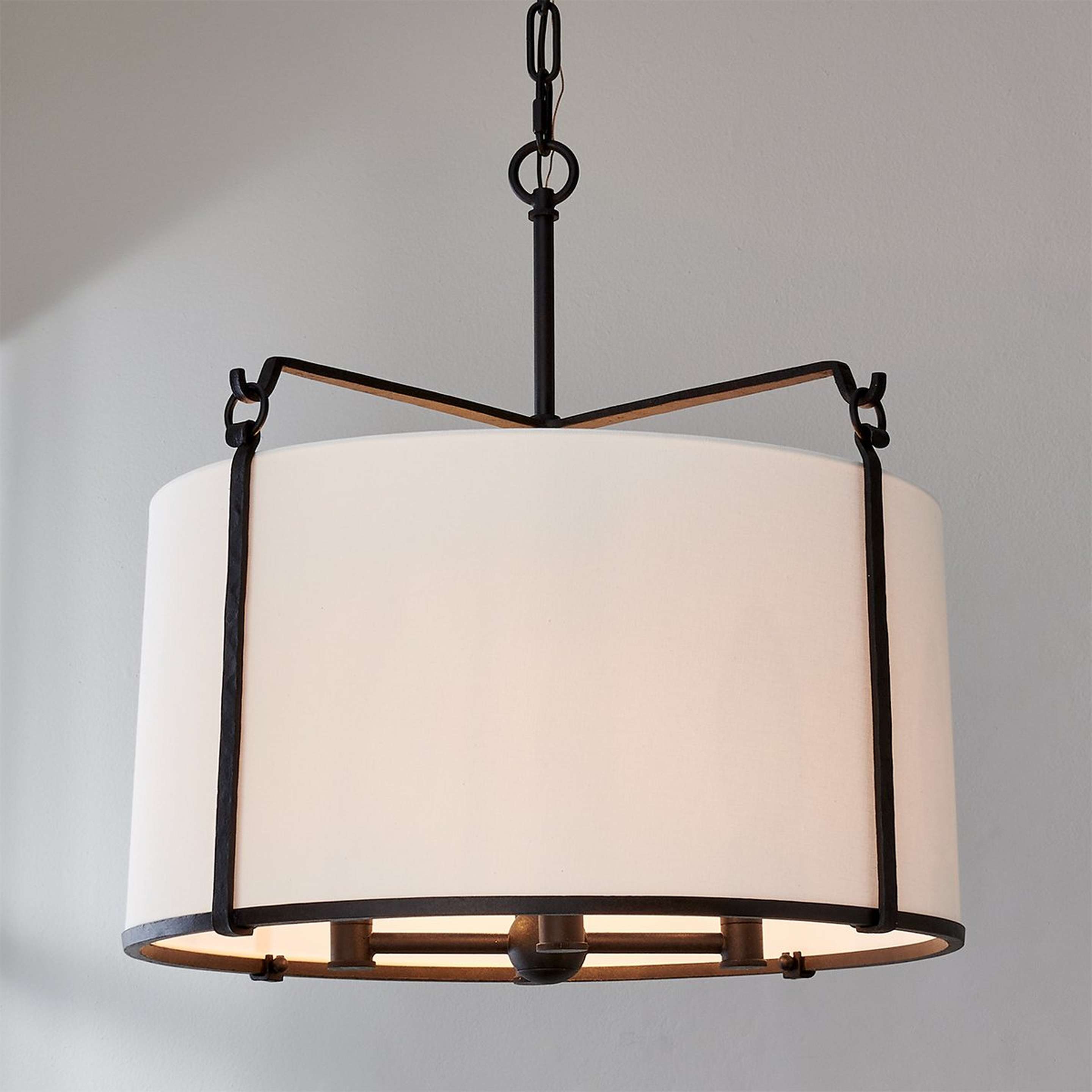 A Loft Shade Chandelier with Blackened Rust color