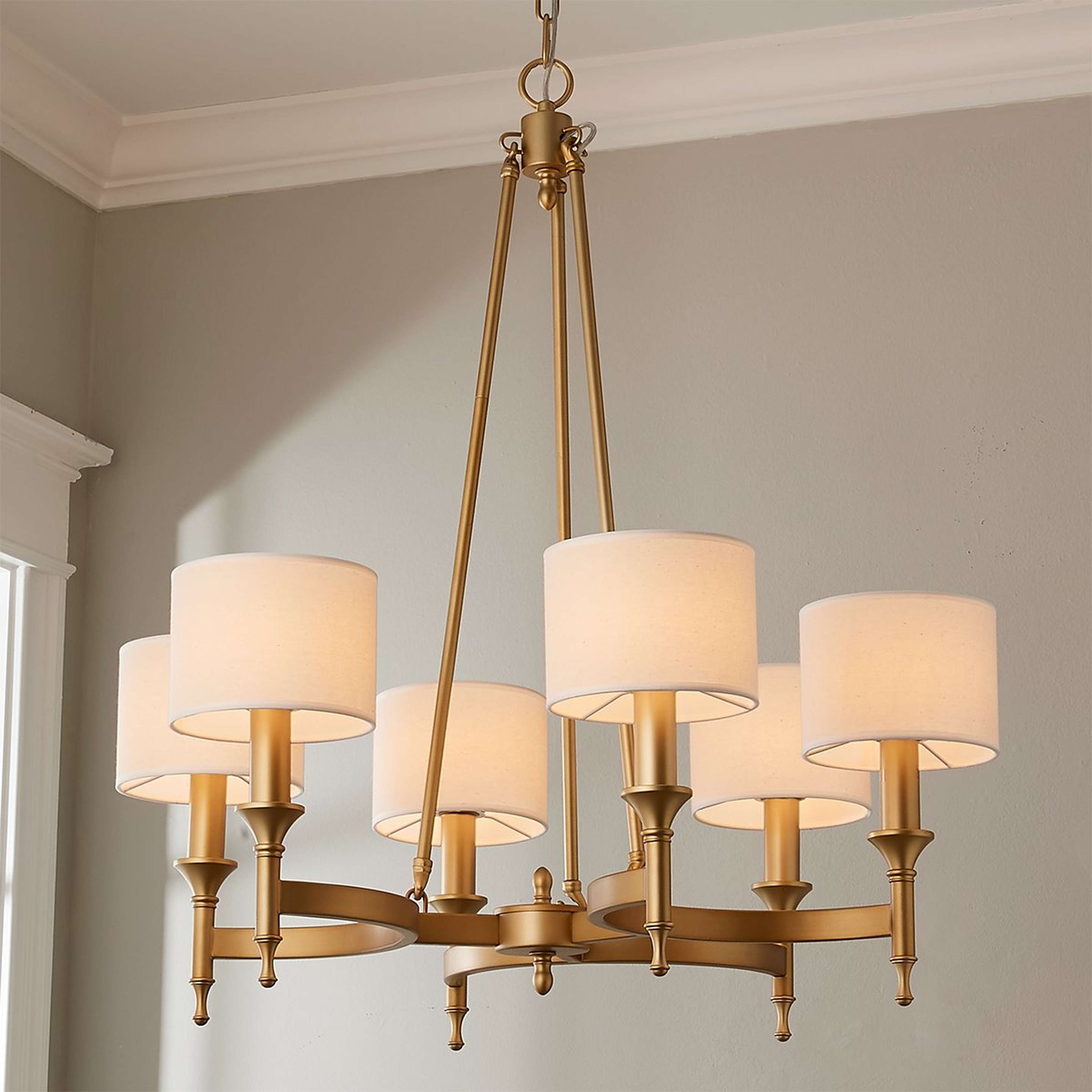 A Metrolume Chandelier with Aged Brass color