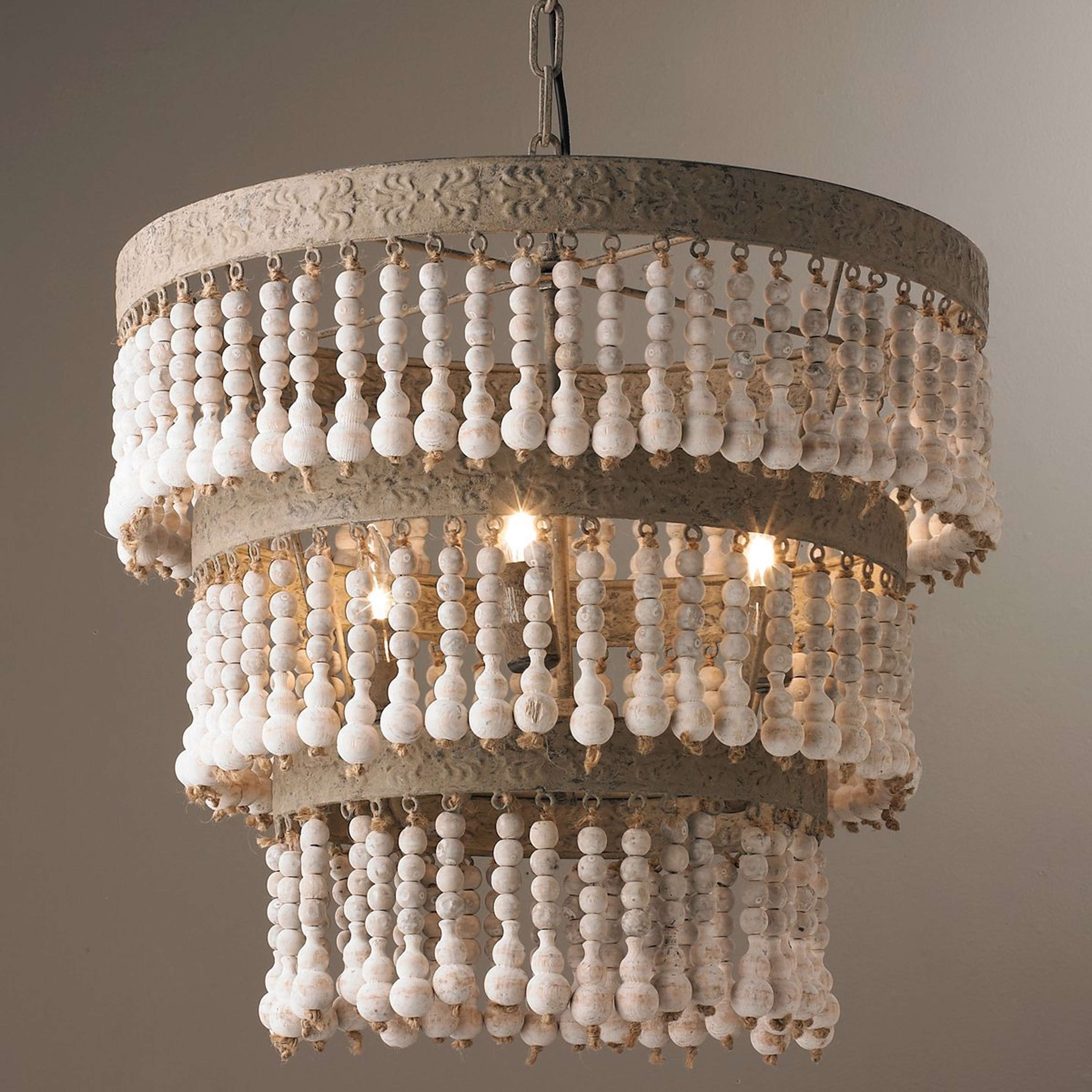 A Three Tiered Wood Beaded Chandelier with Putty / Antique White color