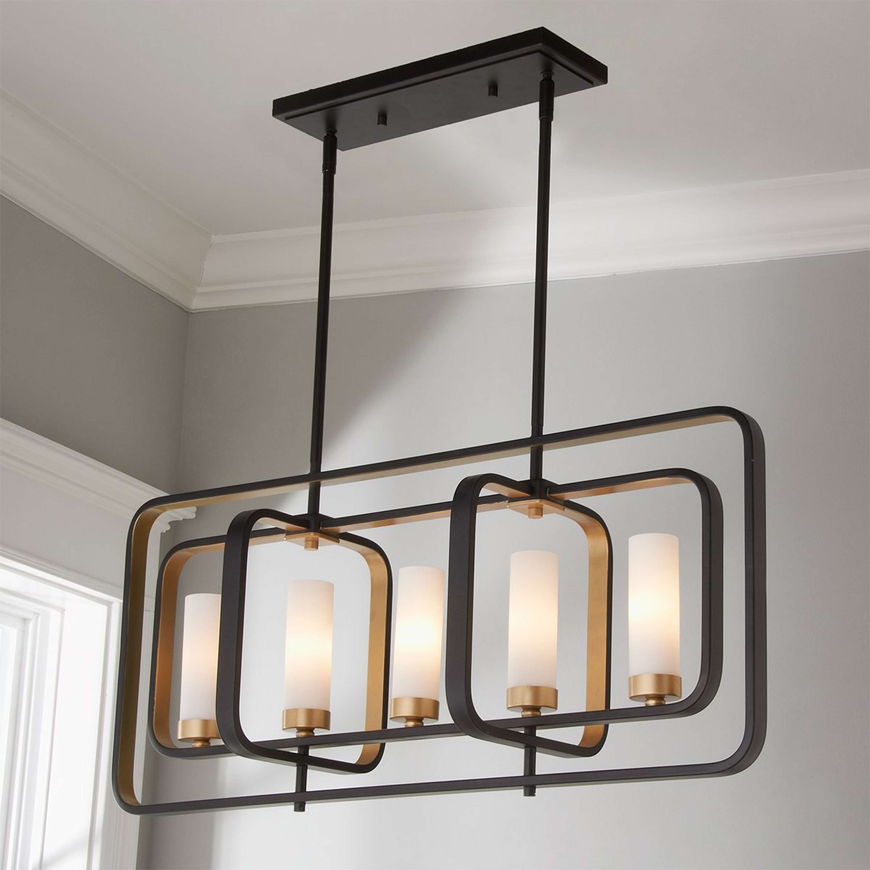 A Soho Loft Linear Chandelier with Bronze / Gold color