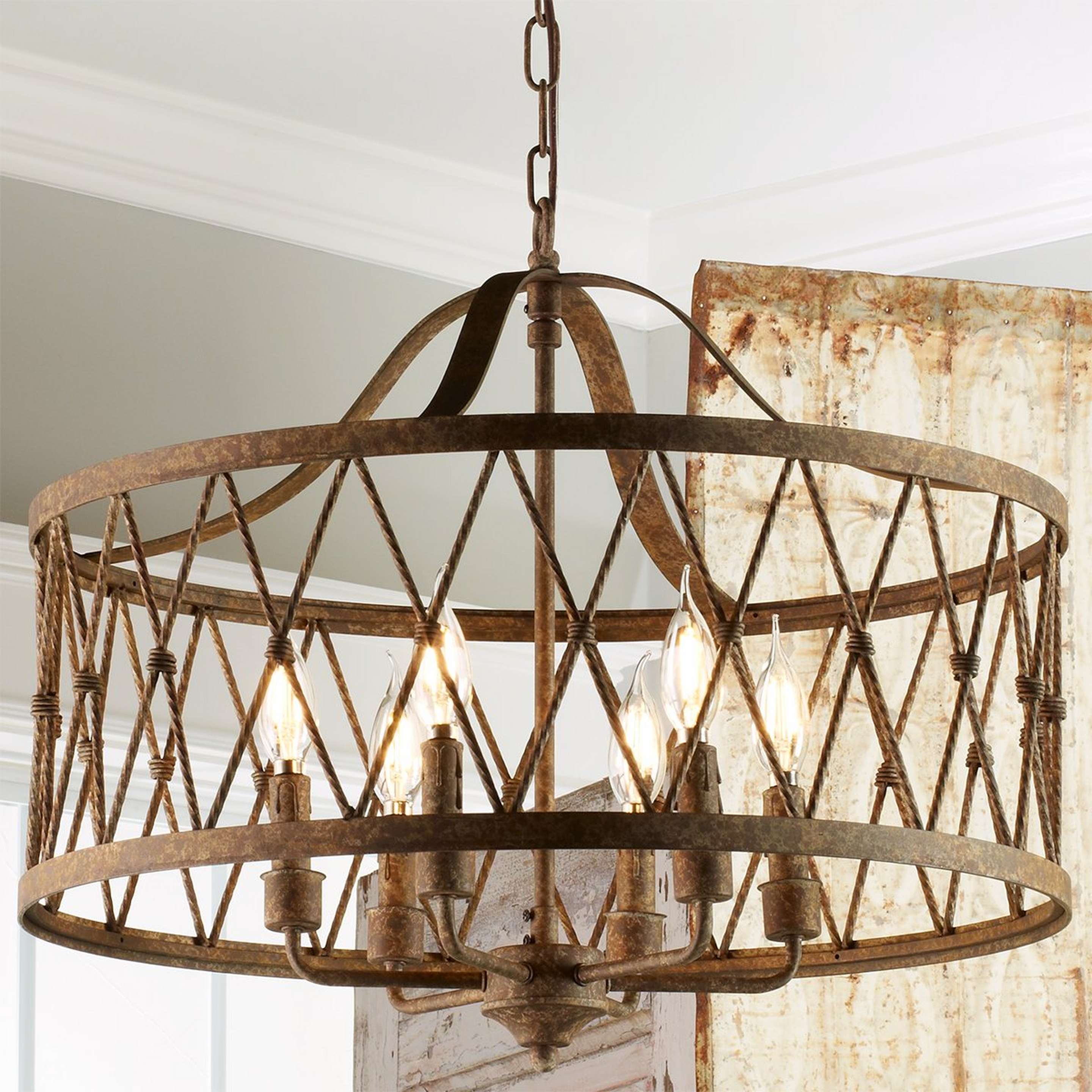 A Faded Rustic Drum Cage Chandelier - 6 Light with Rustic Gold Washed Iron color