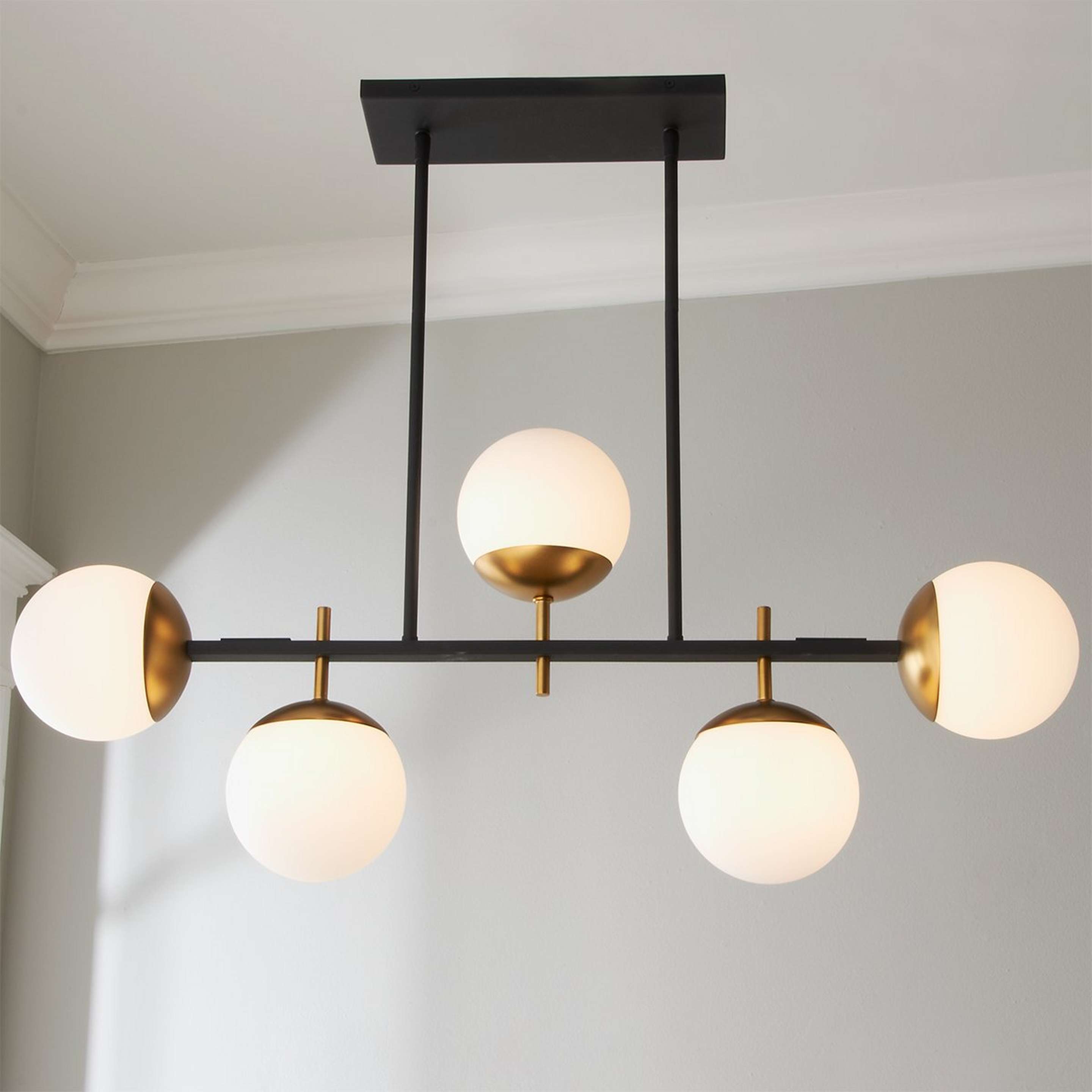 A Harmony Globes Island Chandelier with Black / Satin Gold color