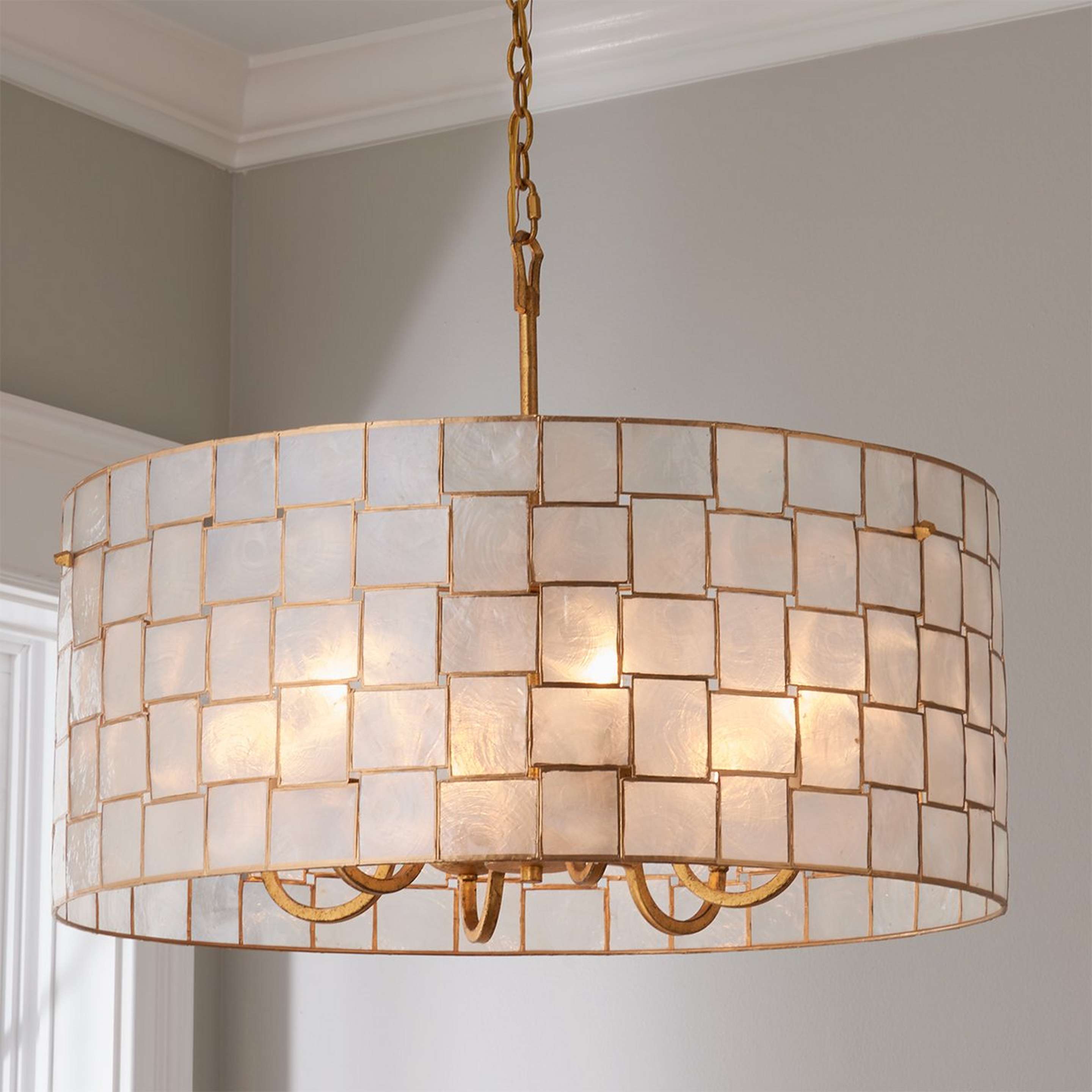 A Captiva Shaken Shell Chandelier with Gold Leaf / Capiz Shell color