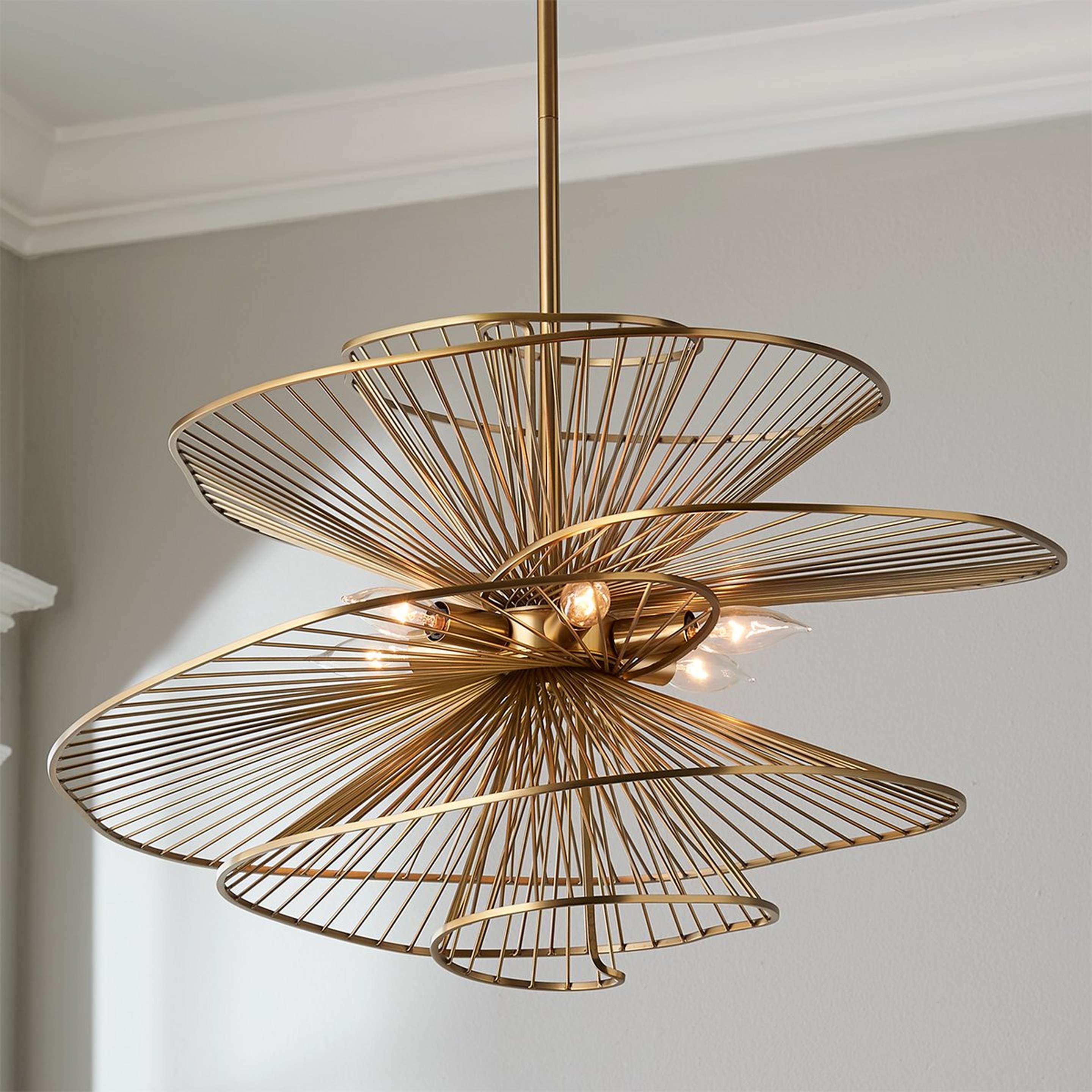 A Ribbon Swirl Chandelier - 6 Light with Brass color