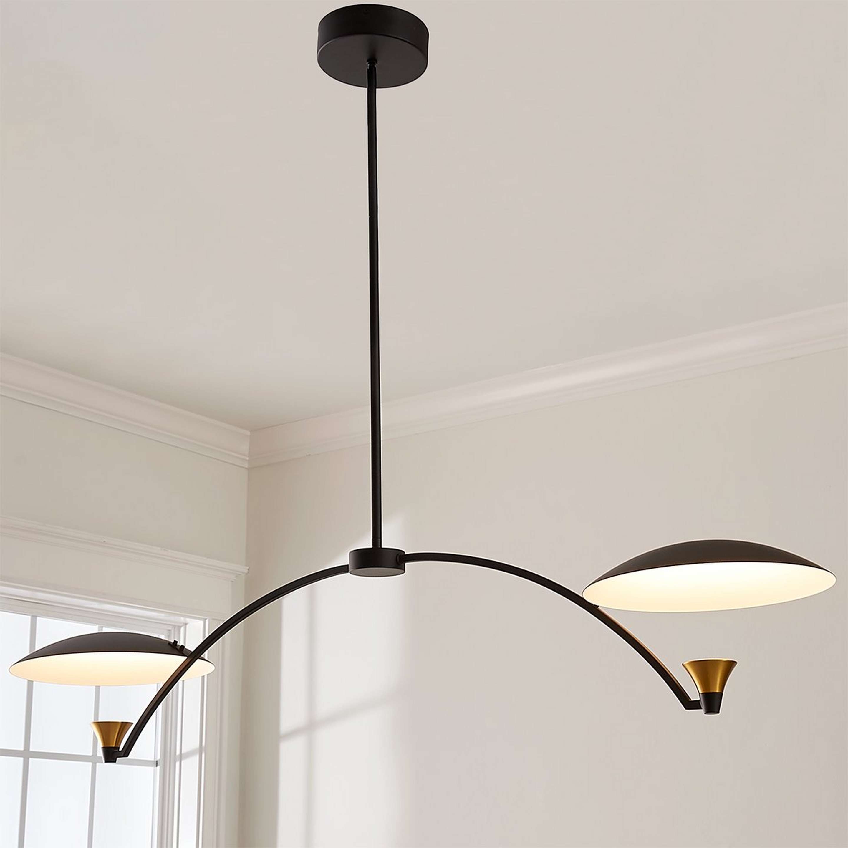 A Caswell LED Island Chandelier with Matte Black / White / Brass color