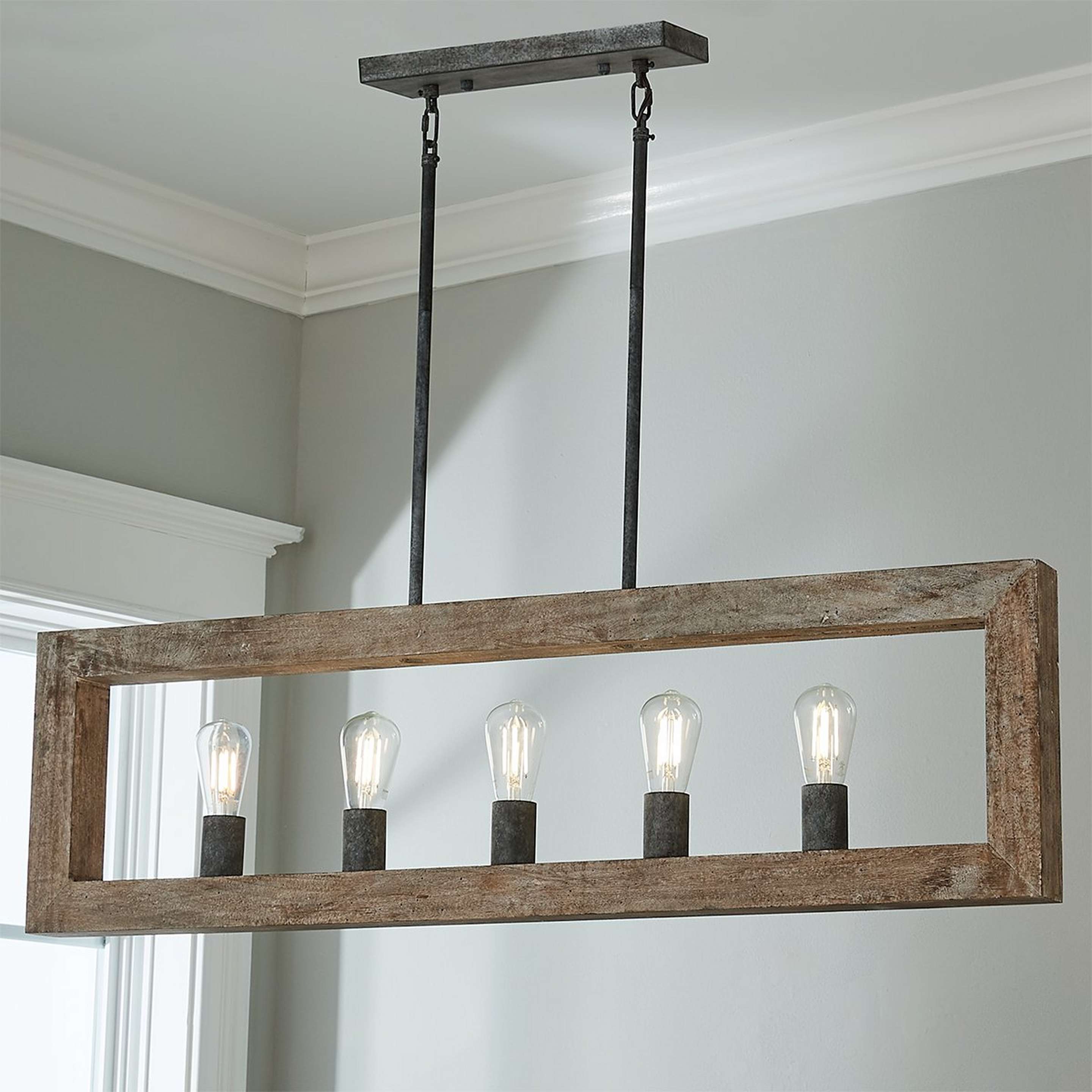 A Waylon Island Chandelier with Rustic Black / Aged Wood color