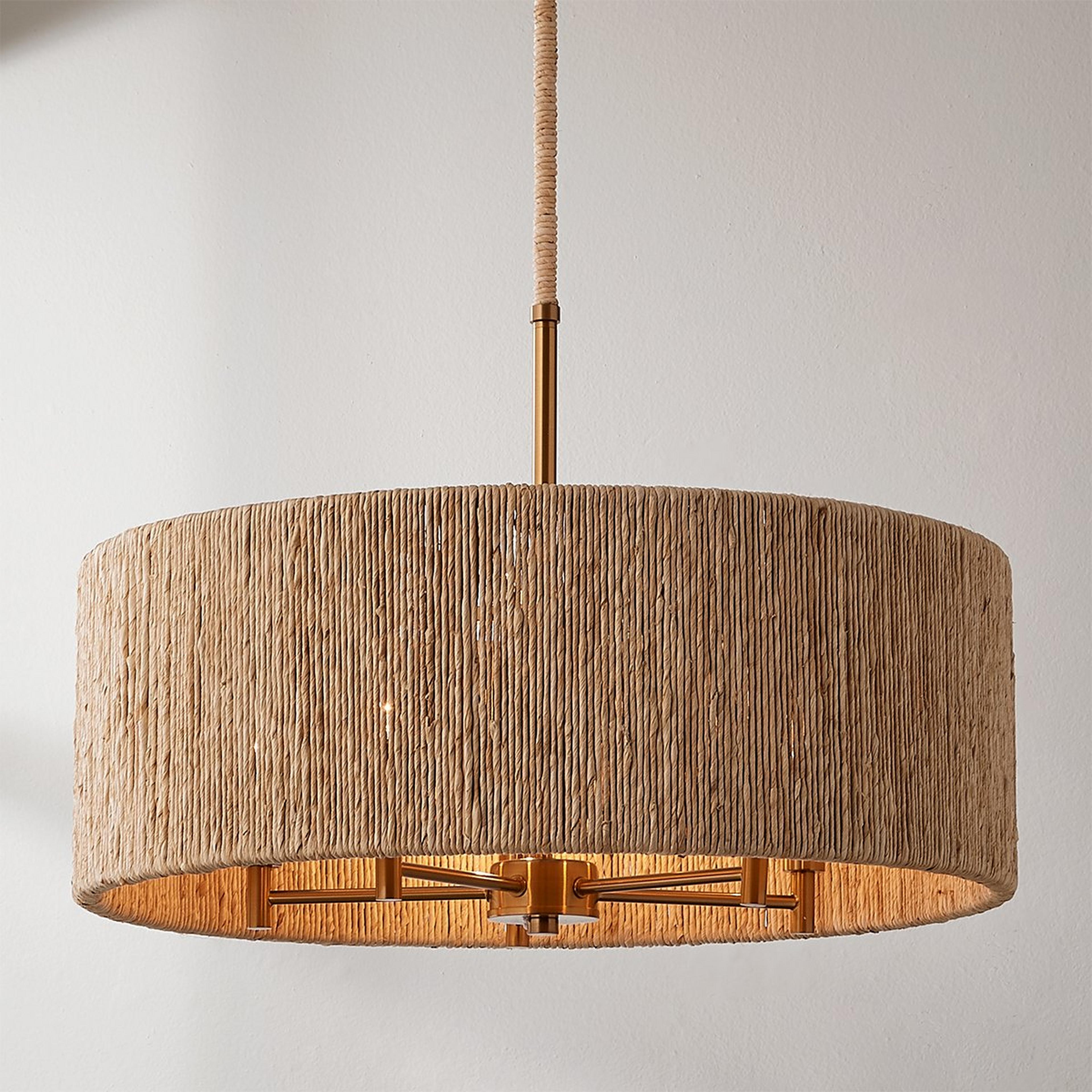 A Copacabana Drum Chandelier with Satin Brass / Abaca Rope color