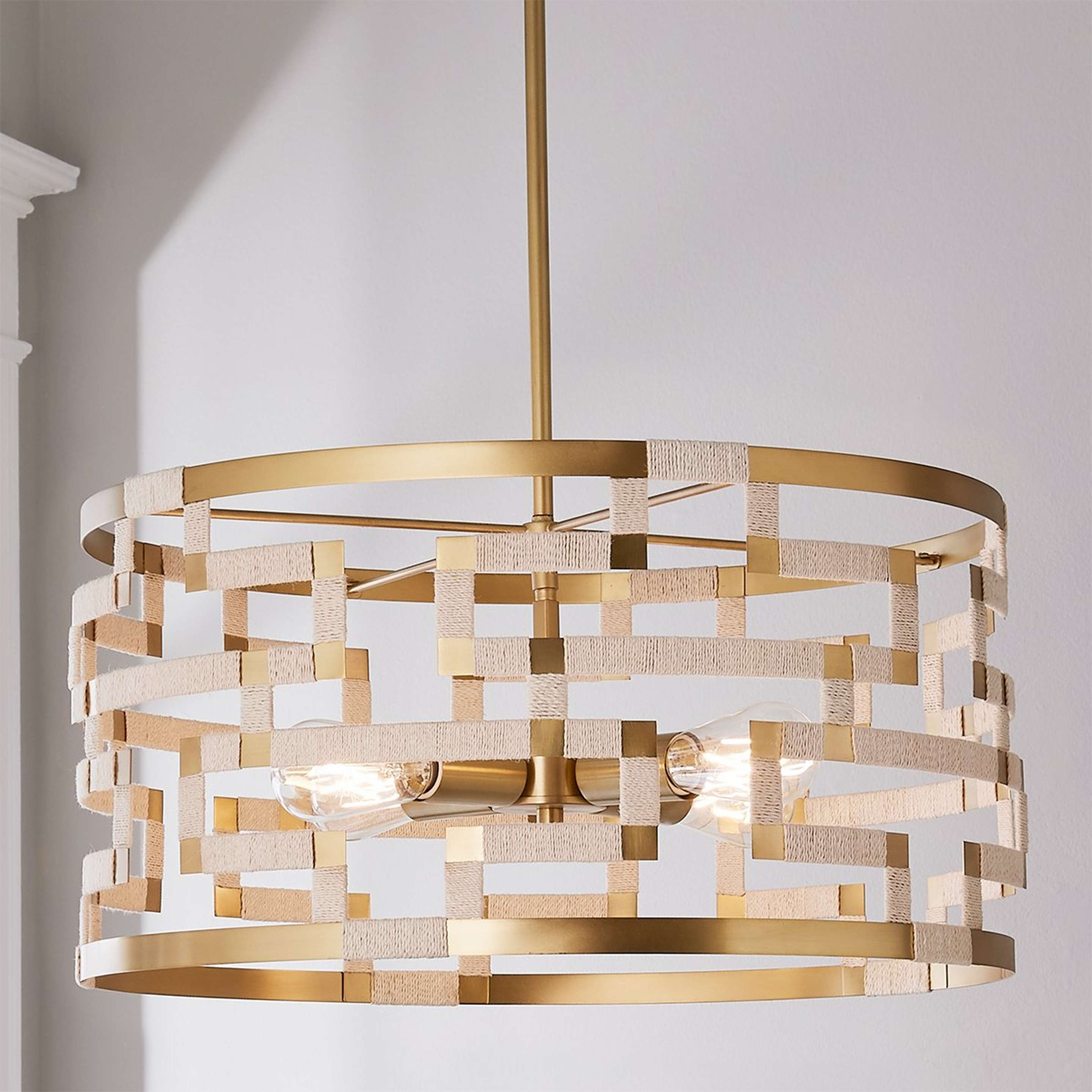 A Threaded Grid Chandelier with Patinaed Brass / Bleached Jute color