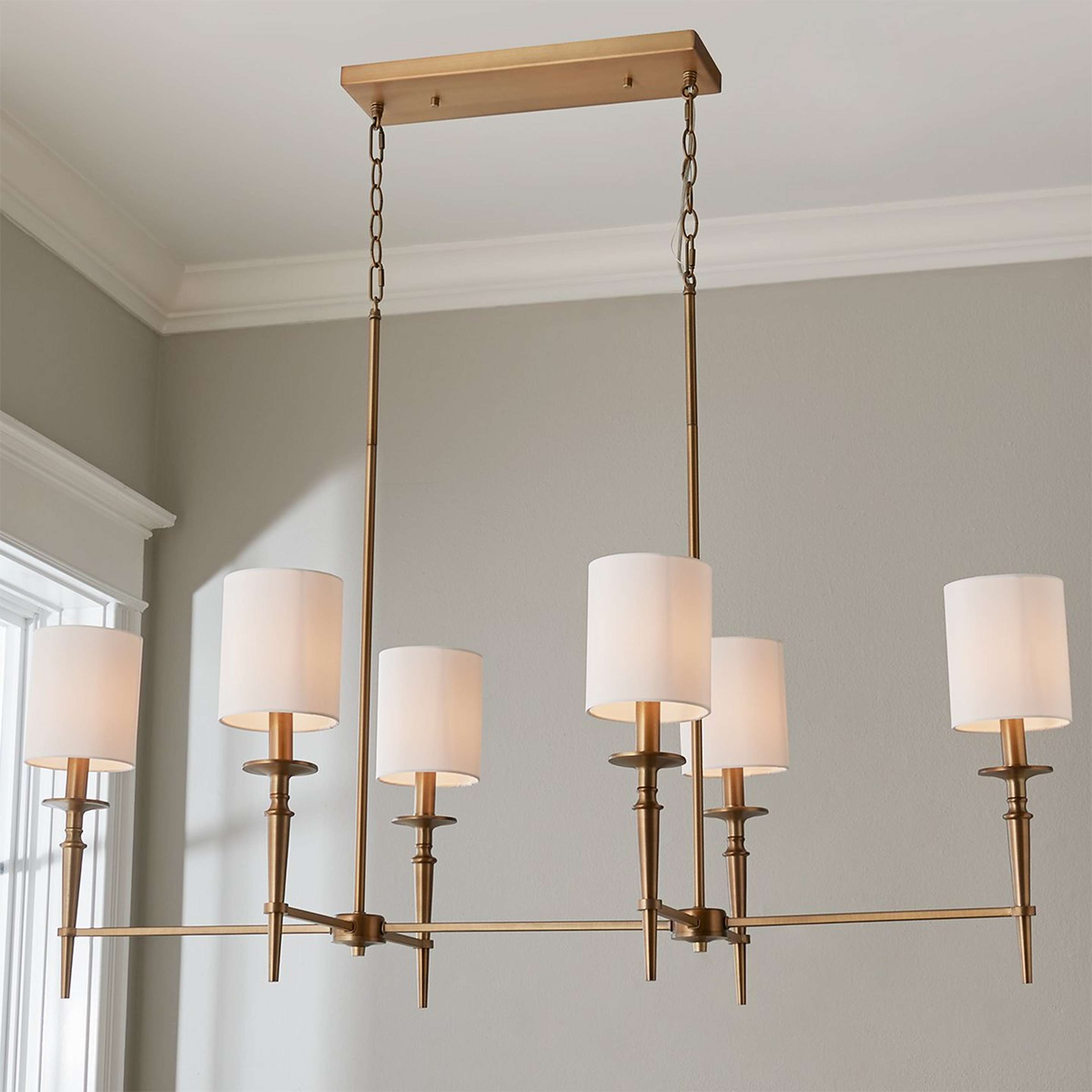 A Bella Island Chandelier with Aged Brass color
