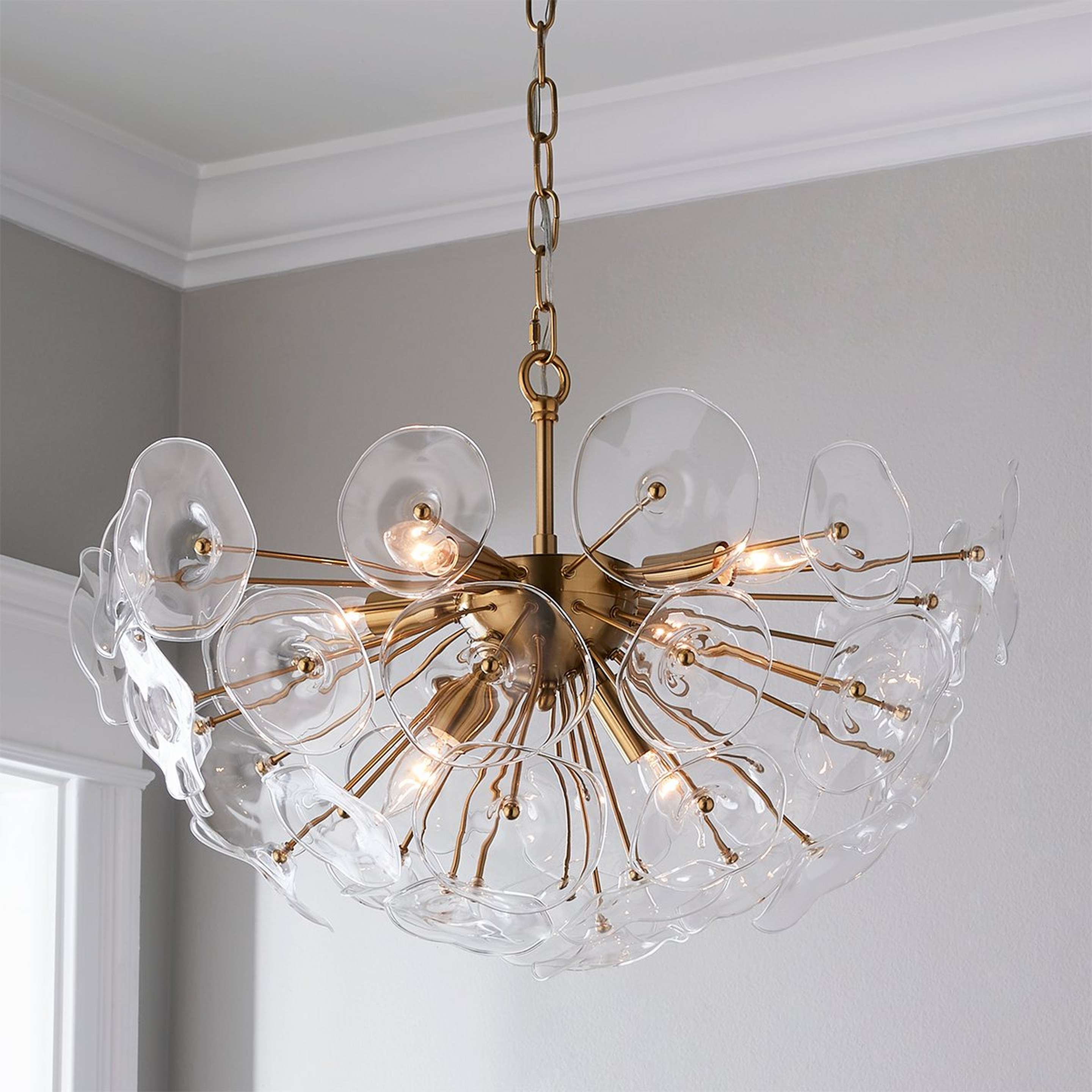 A Kendari Chandelier with Aged Brass / Clear Glass color