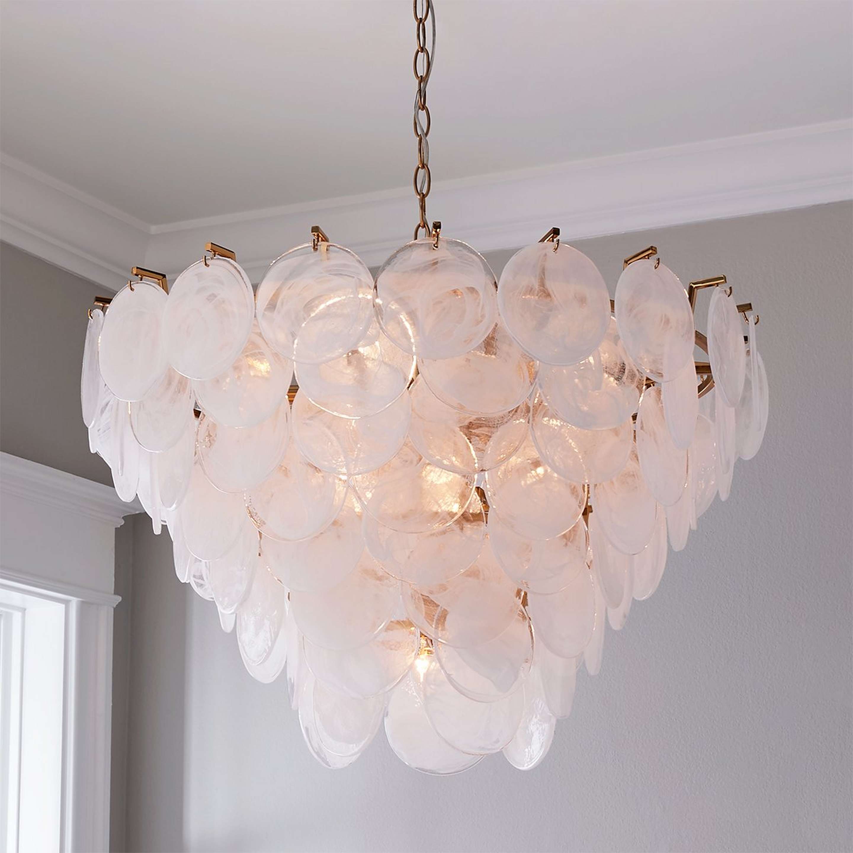 A Bali Shell Chandelier with Polished Brass / Translucent Glass Shell color