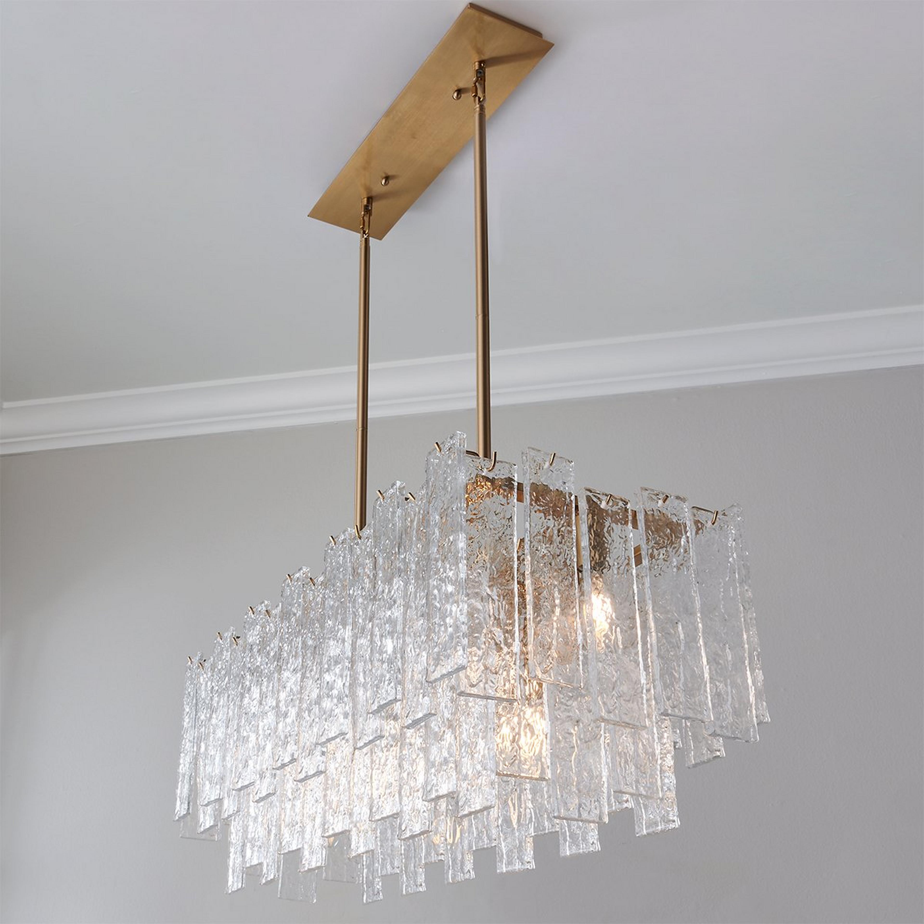 A Great Falls Island Chandelier with Brass / Textured Glass color