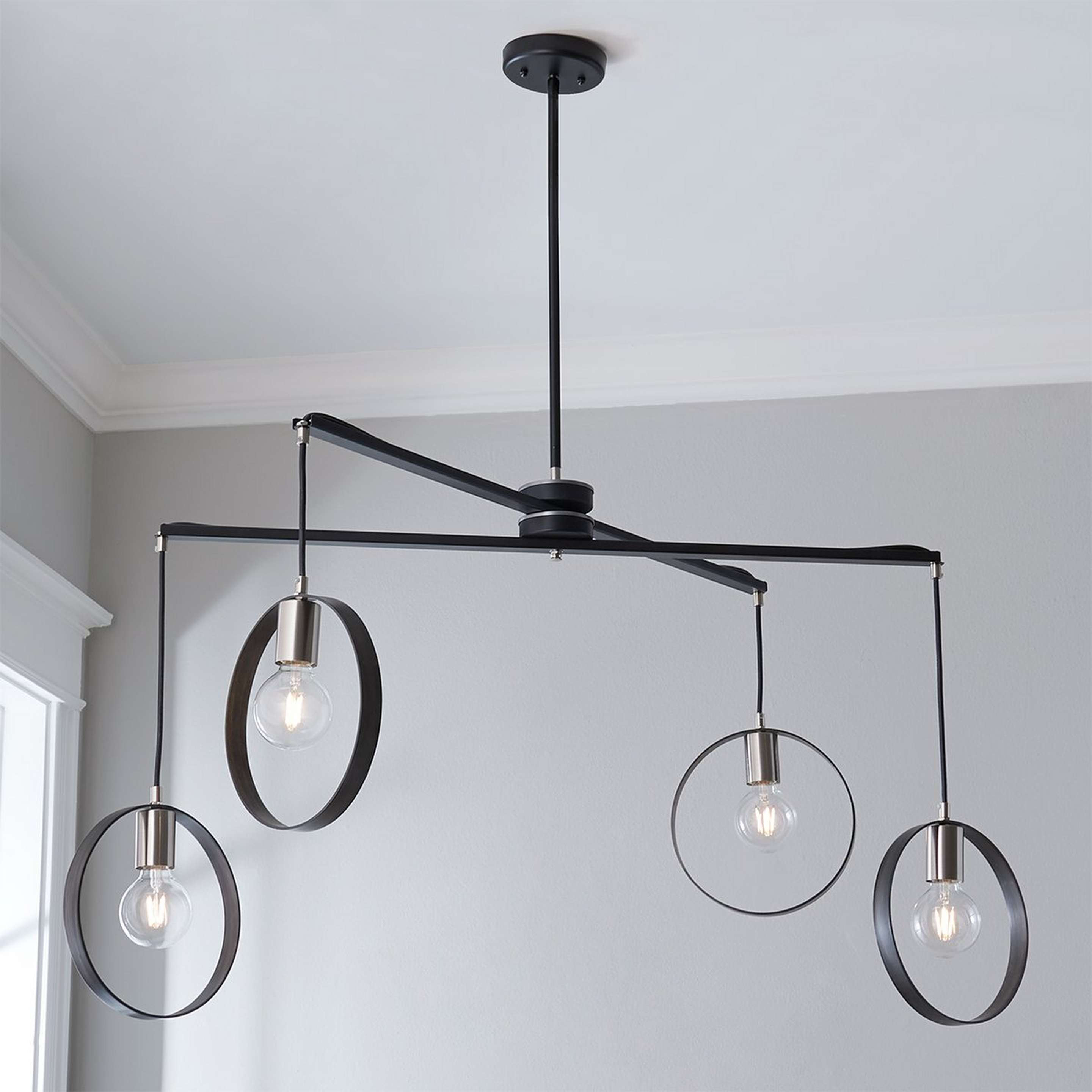 A Wendy Umanoff Cross Beam X Chandelier with Black / Satin Nickel color