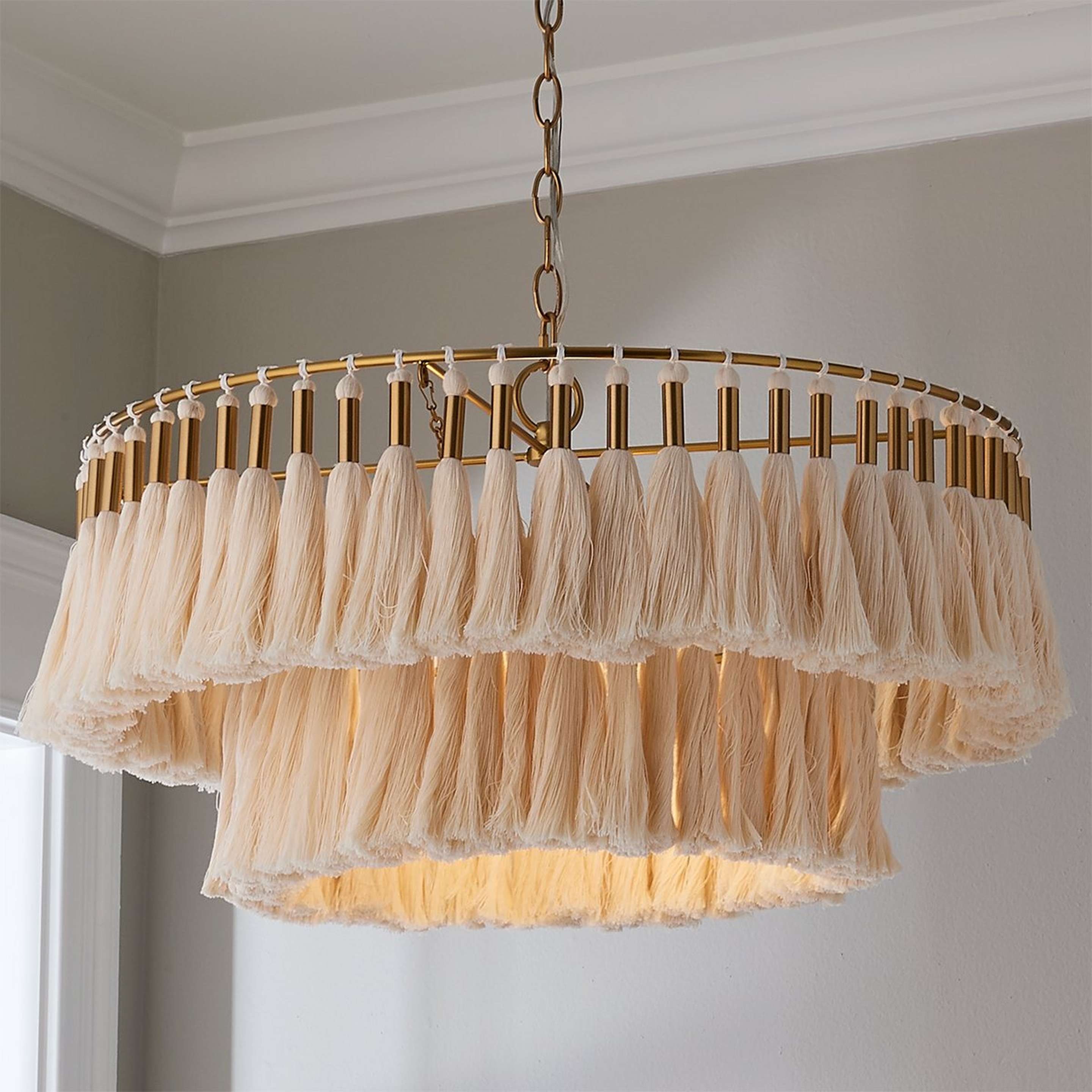 A Toni Tassel Tiered Chandelier with Antique Brass / Cream color