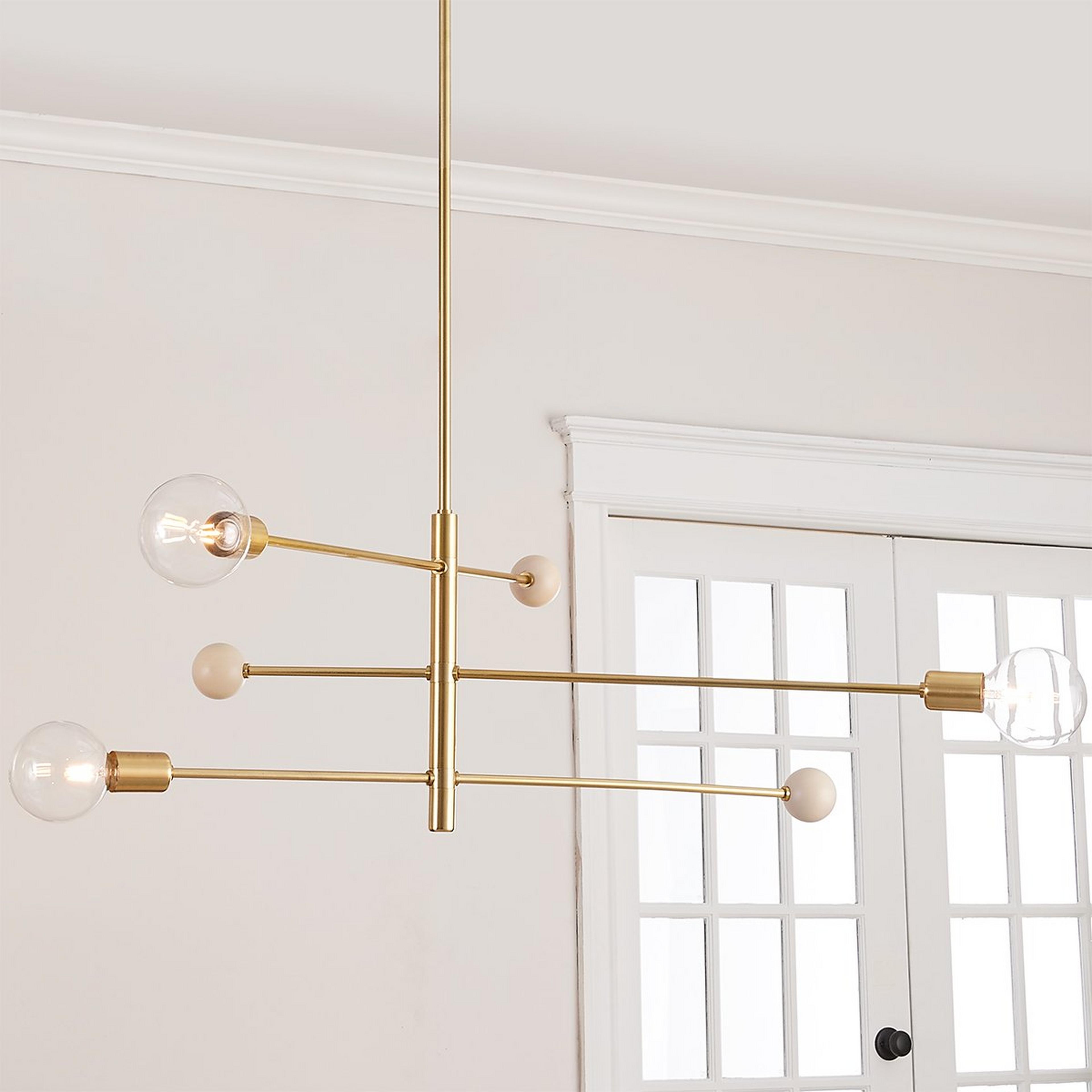 A Low Sky Chandelier with Aged Brass / Whitewash Detail color
