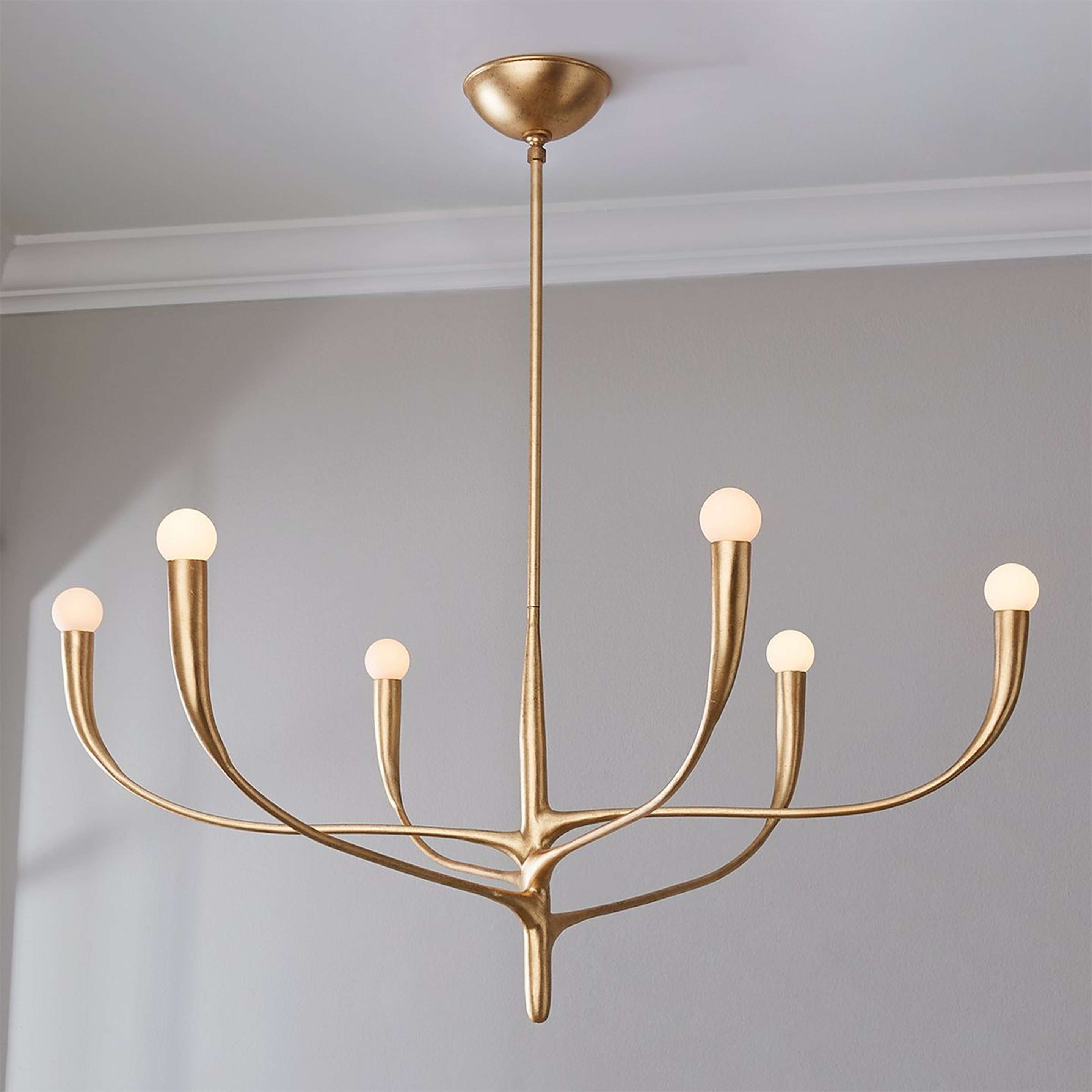 A Cheyane Chandelier with Gold Leaf color