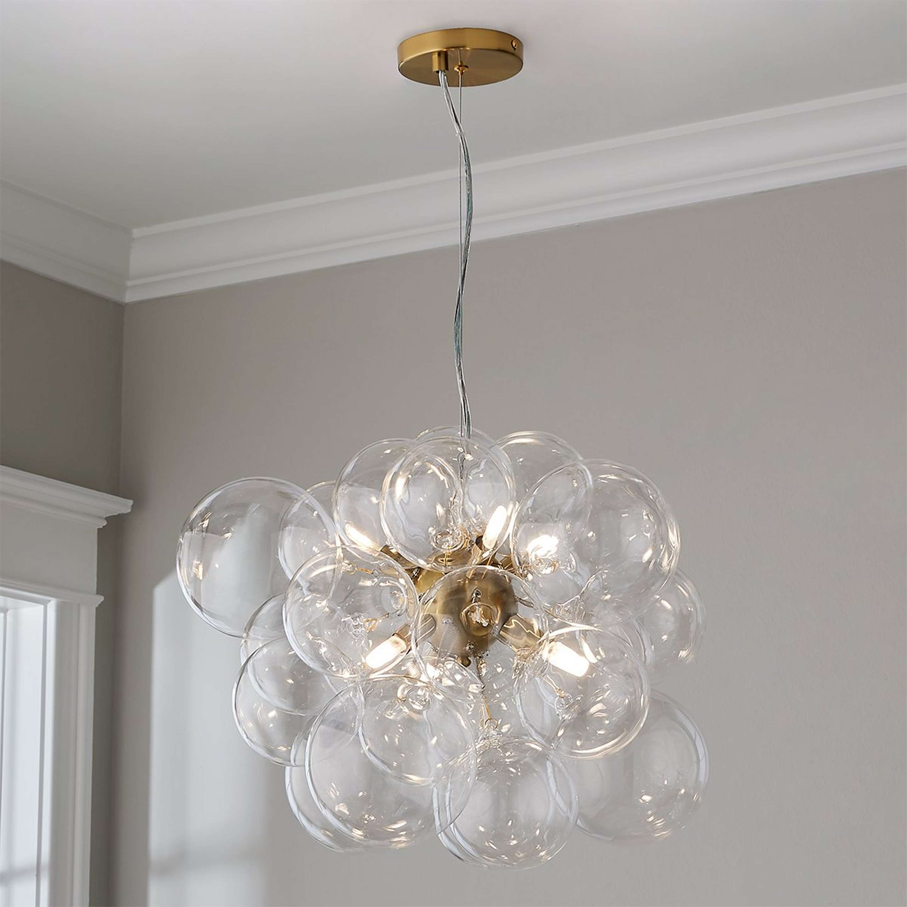 A Bowlby Chandelier with Aged Brass / Clear Glass color