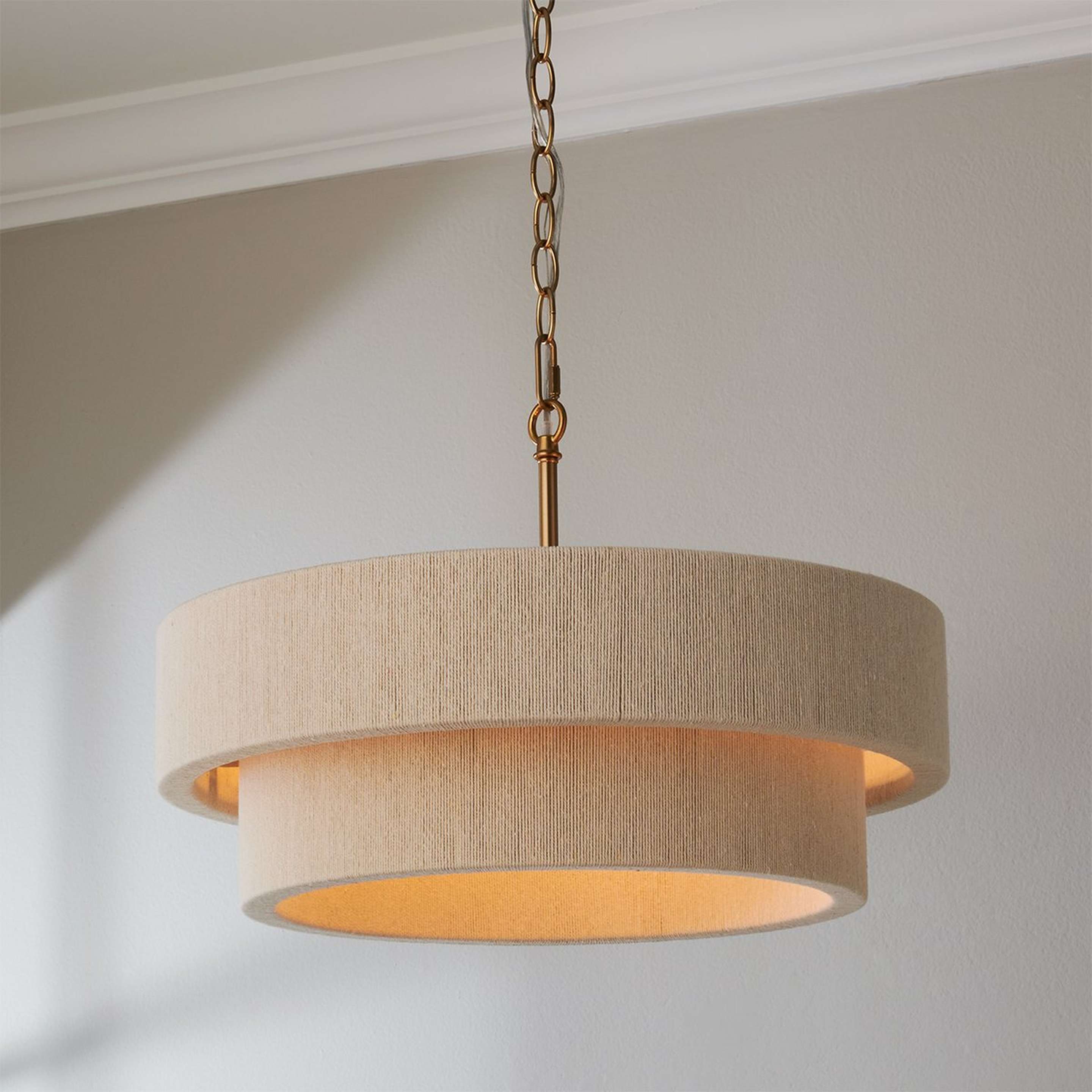 A Kalini Double Drum Convertible Chandelier with Matte Brass / Bleached Natural Rope color