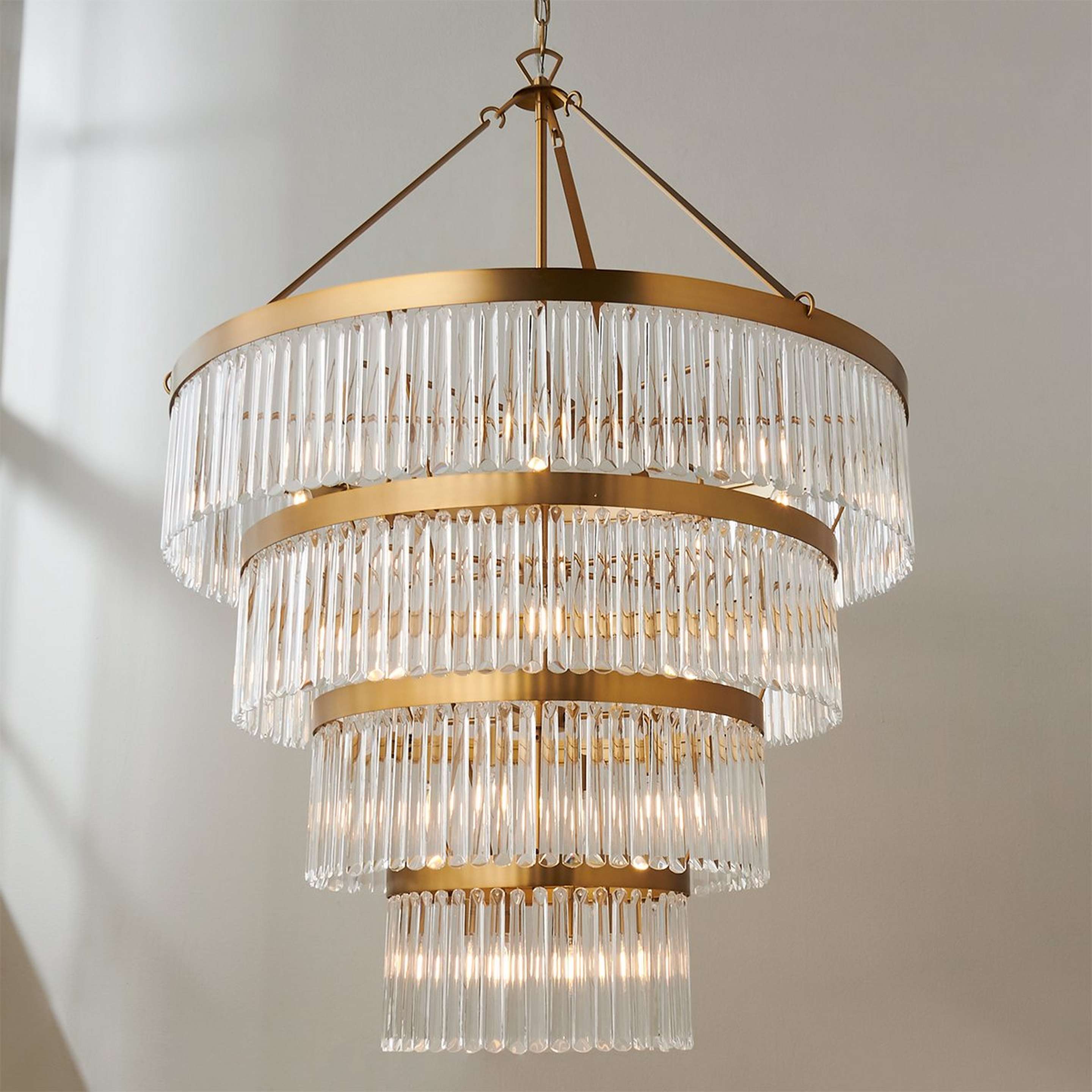 A Crystal Alstro Four-Tier Chandelier with Gold / Crystal color