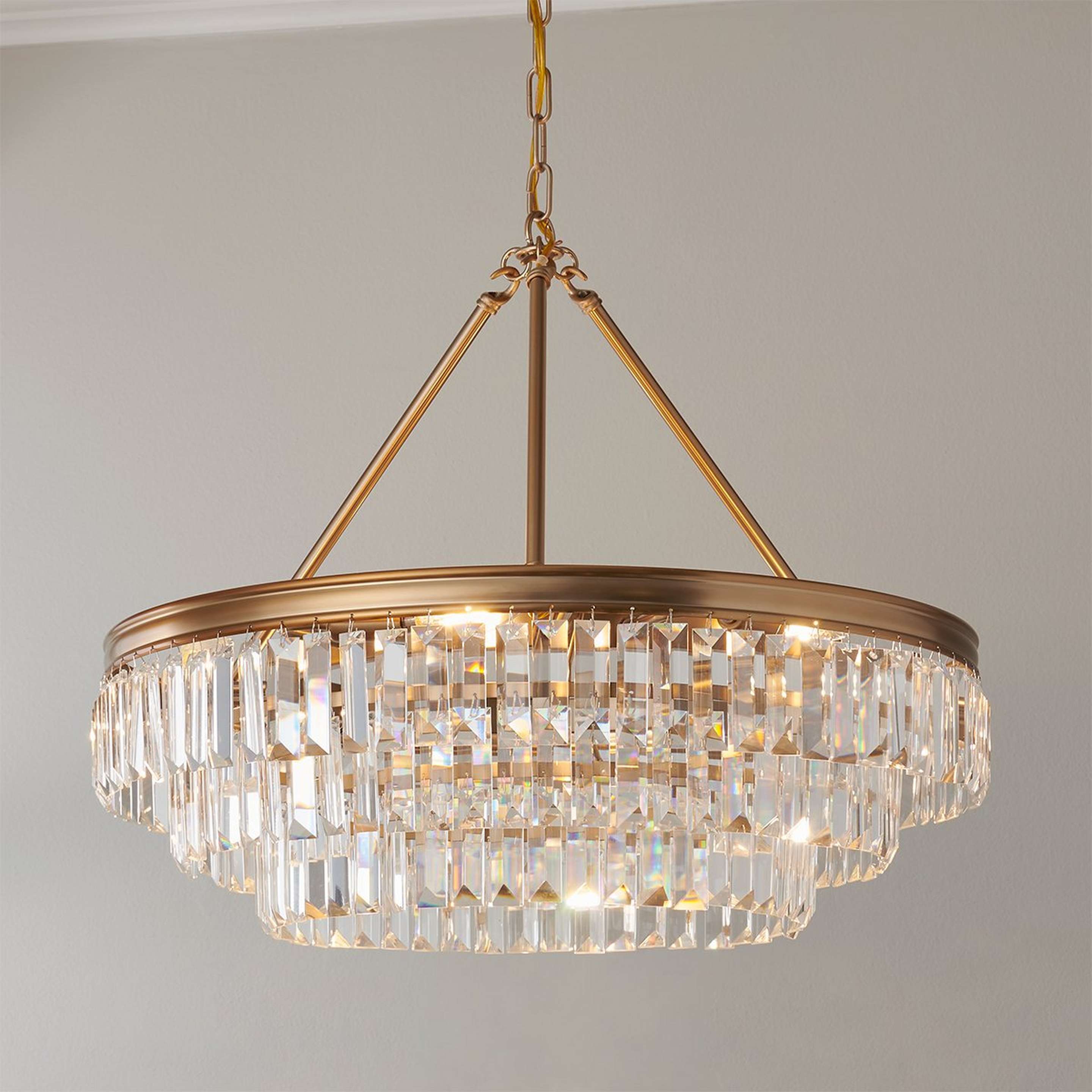 A Faceted Glass Layered Chandelier - 25" with Gold color