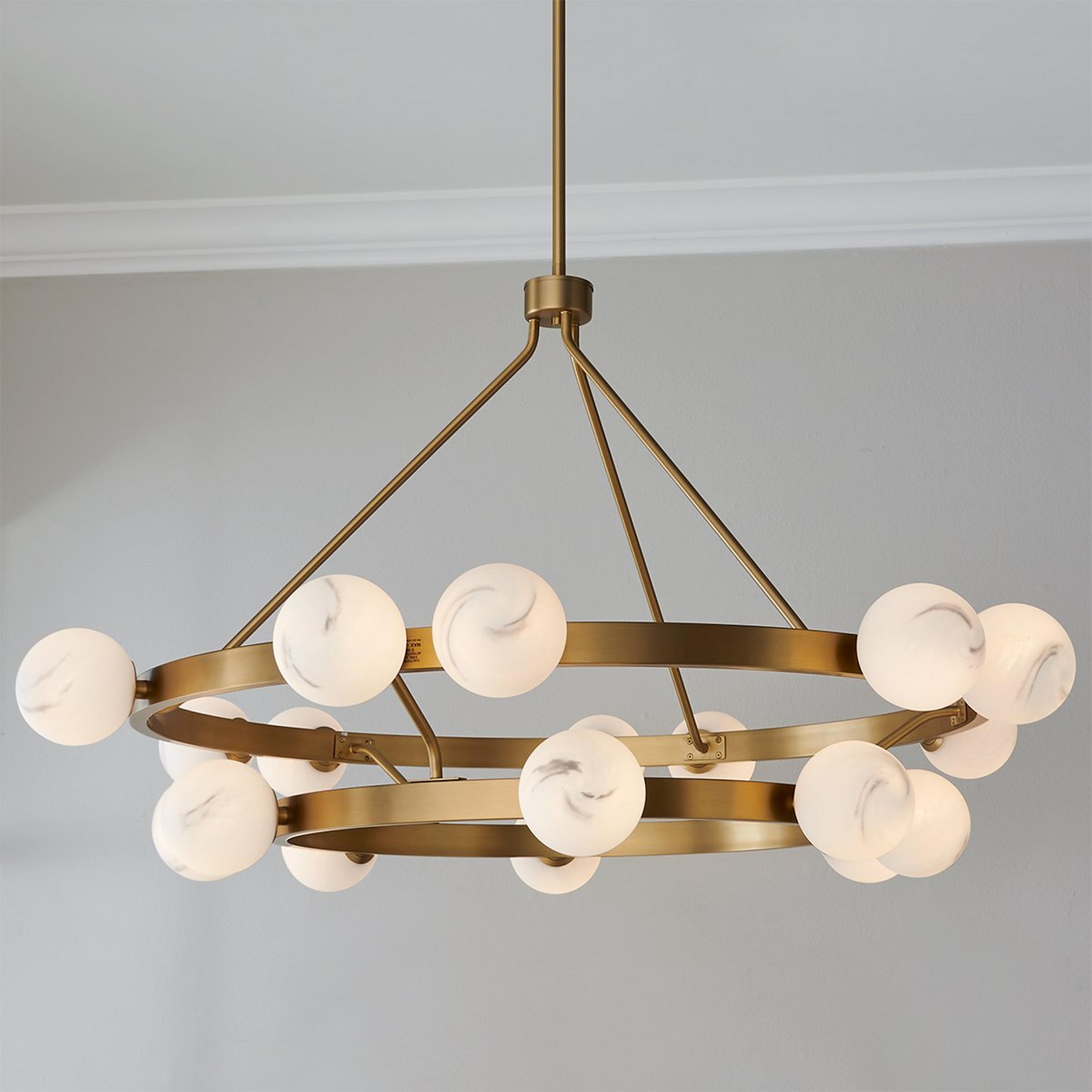 A Remolino Chandelier with Satin Brass / Swirled Glass color