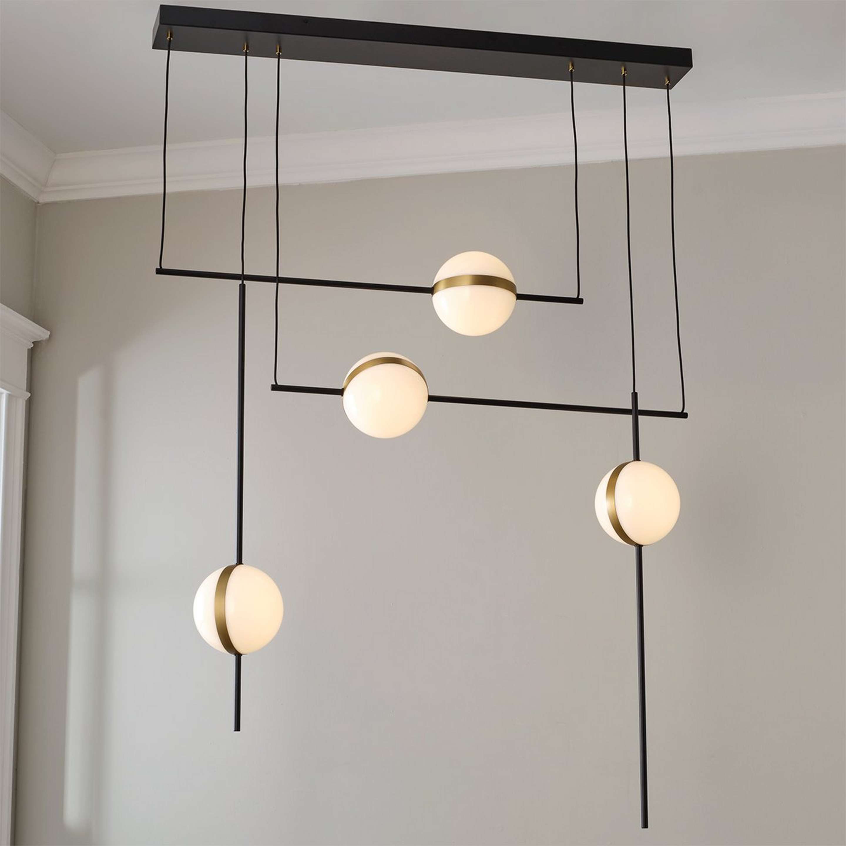 A Loika Linear Chandelier with Black / Gold color