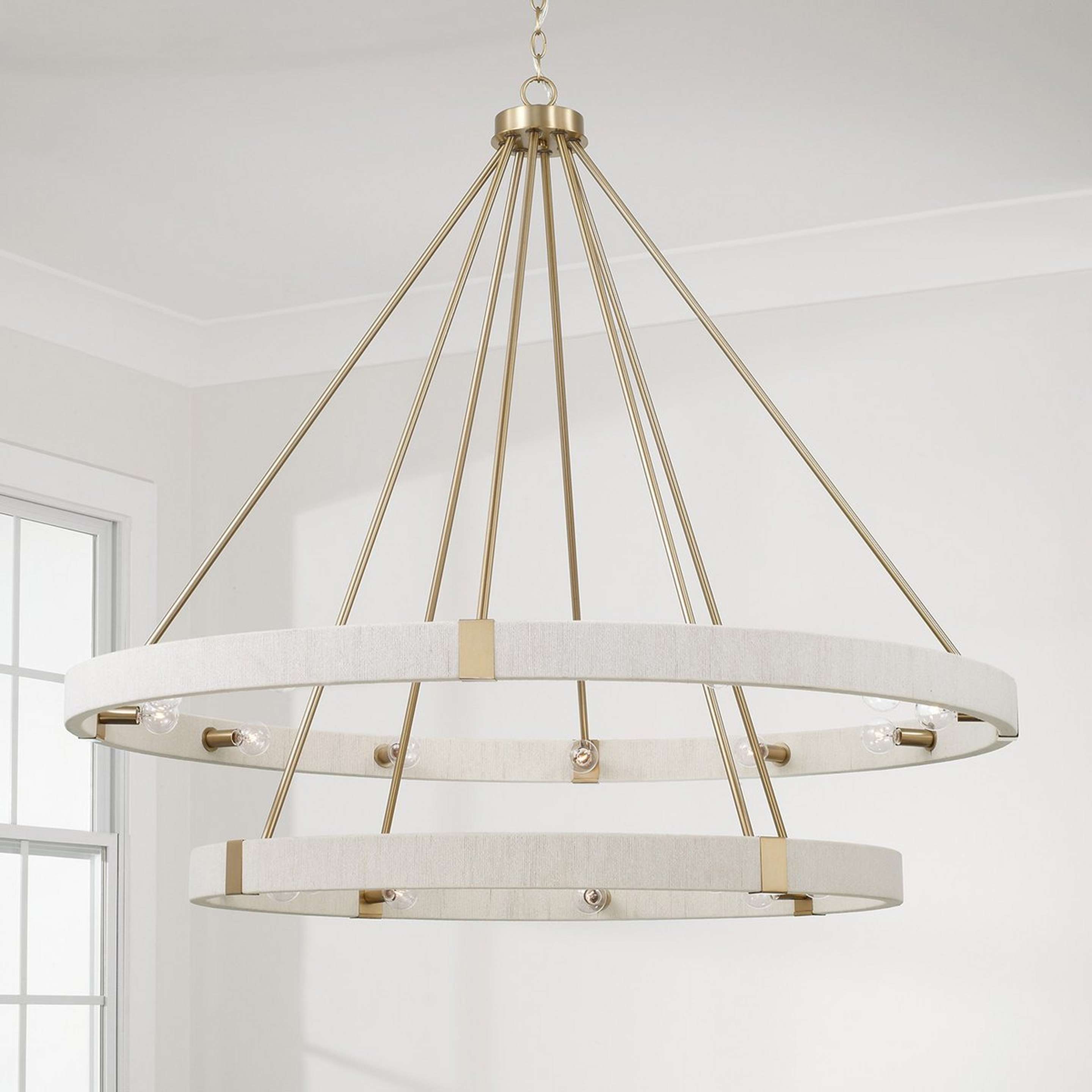 A Kalini Chandelier - 20 Light with Matte Brass / Bleached Natural color