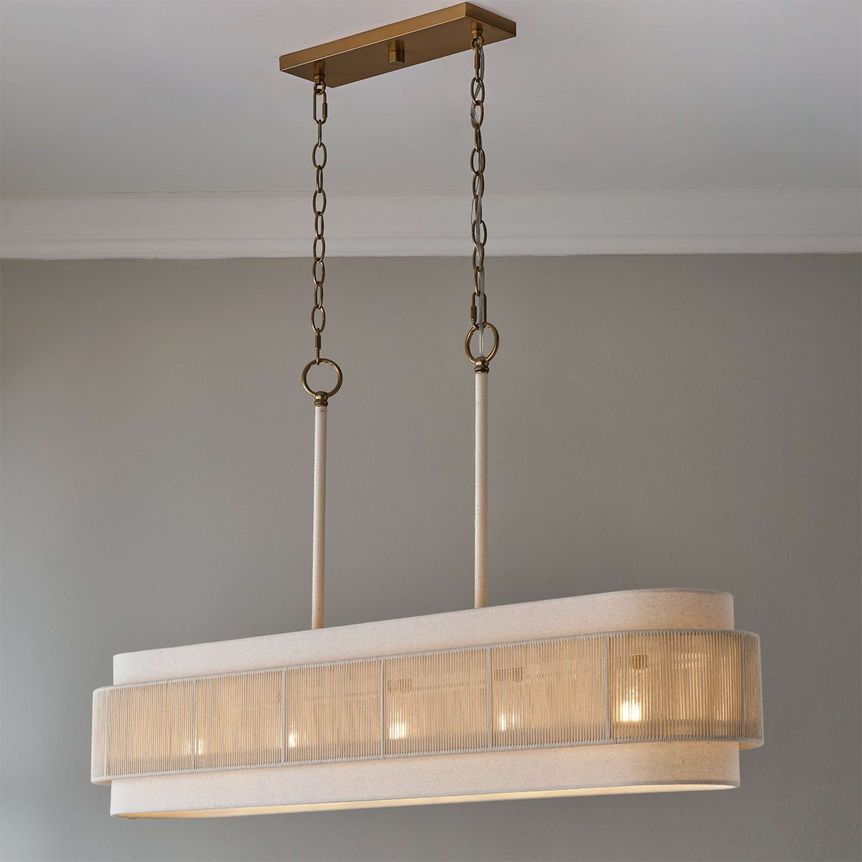 A Rodanthe Island Chandelier with Aged Brass / White Cotton color