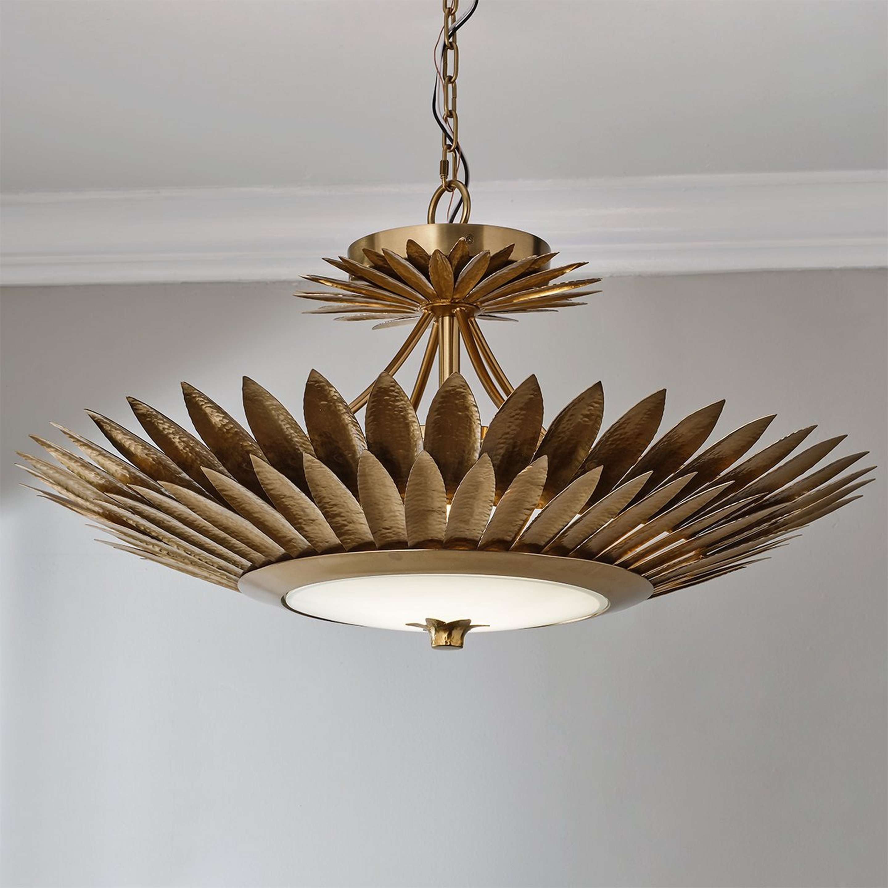 A Vihan Convertible LED Chandelier with Antique Brass / Opal Glass color