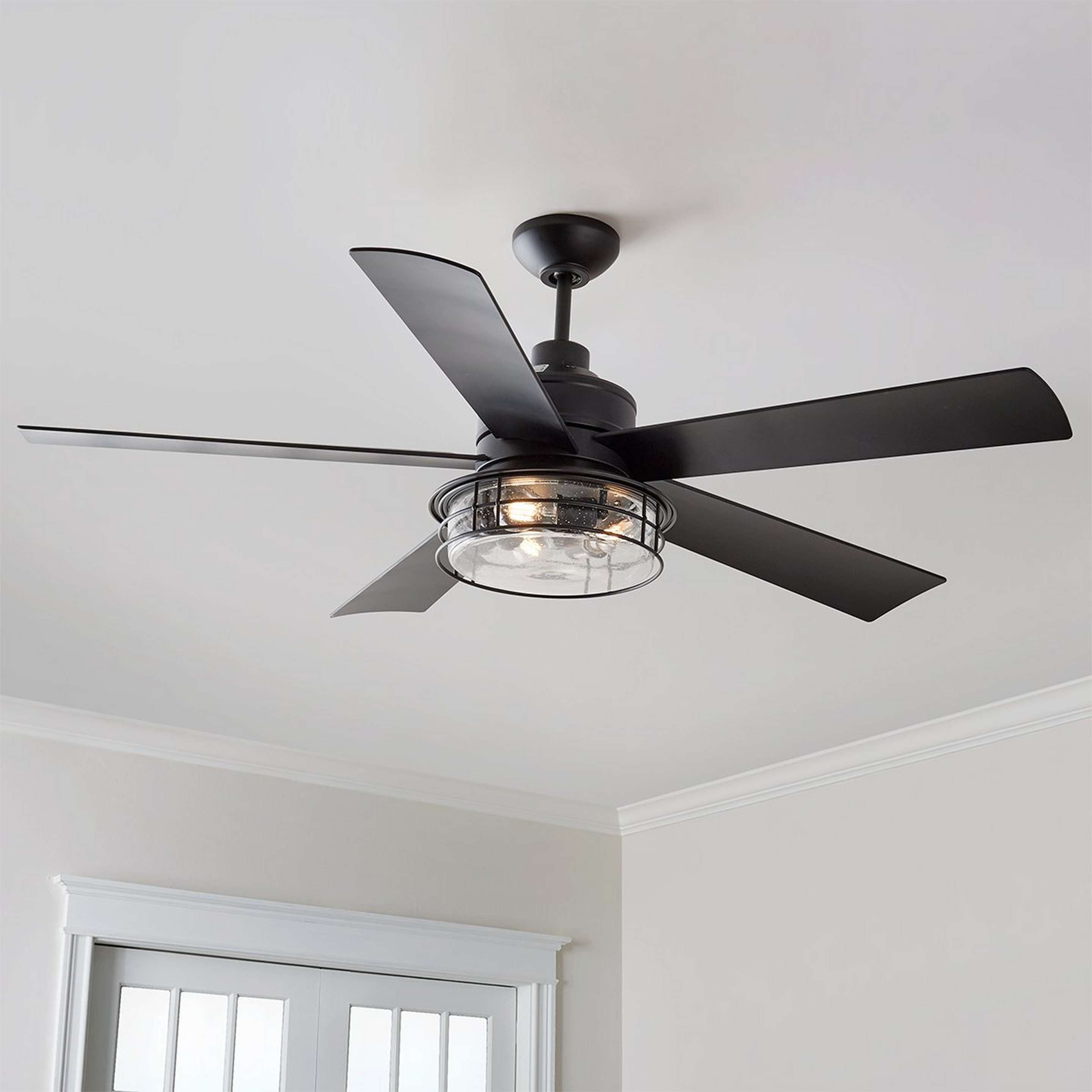 A 56" Garrett Farmhouse Ceiling Fan with Black / Clear Seeded Glass color
