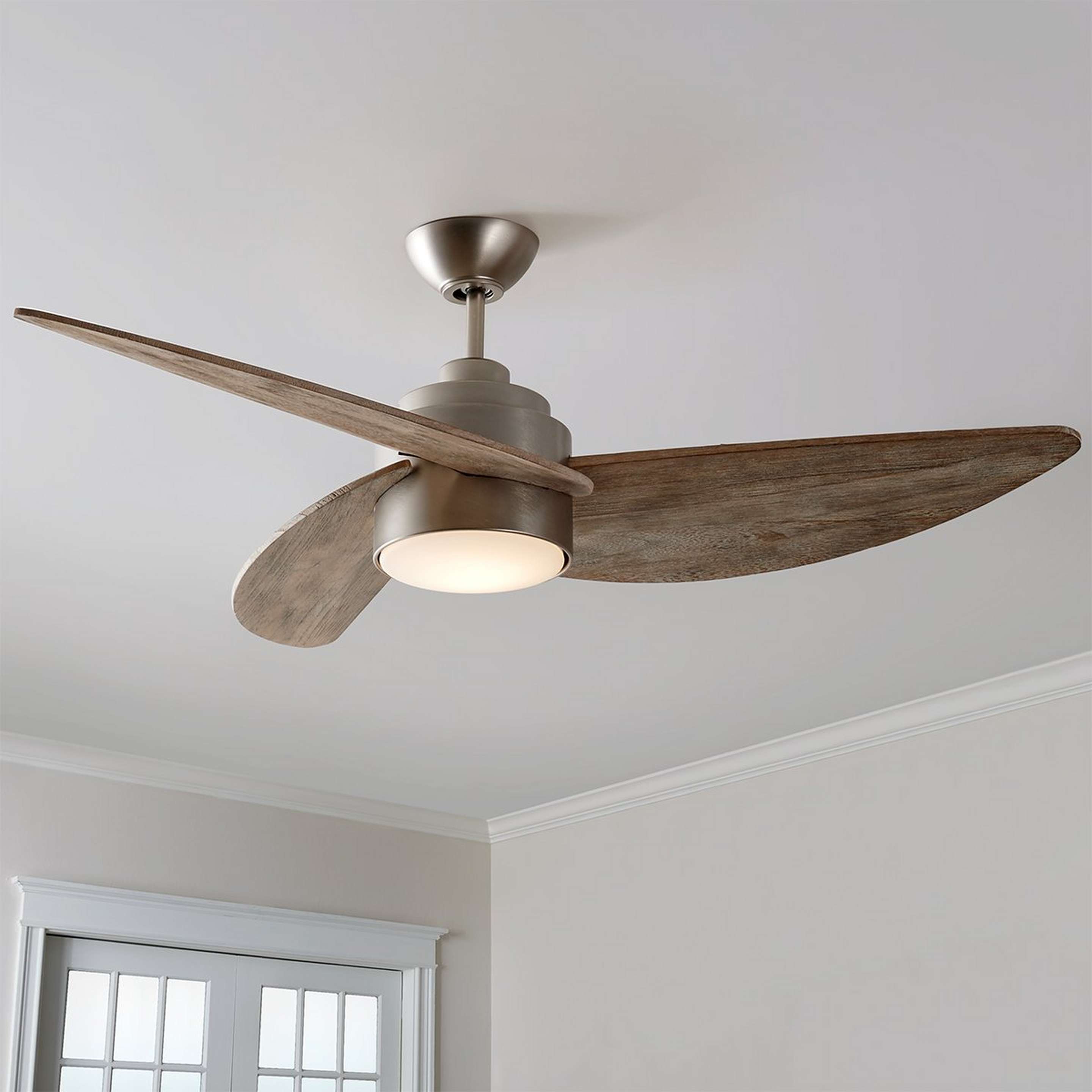 A 52" Whirligig LED Ceiling Fan with Satin Nickel / Weathered Oak color