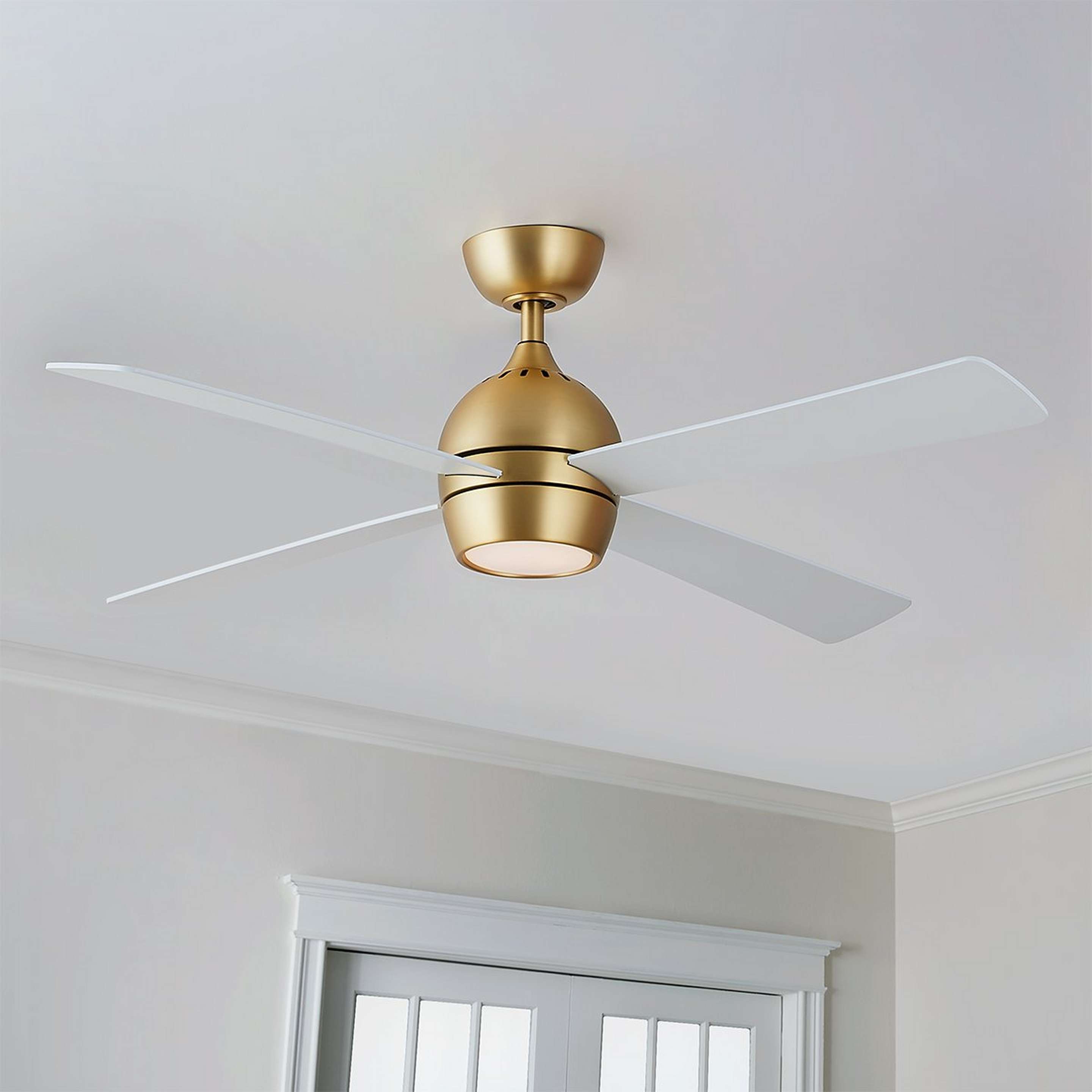 A 52" Boreas LED Ceiling Fan with Brushed Brass / White Blades color