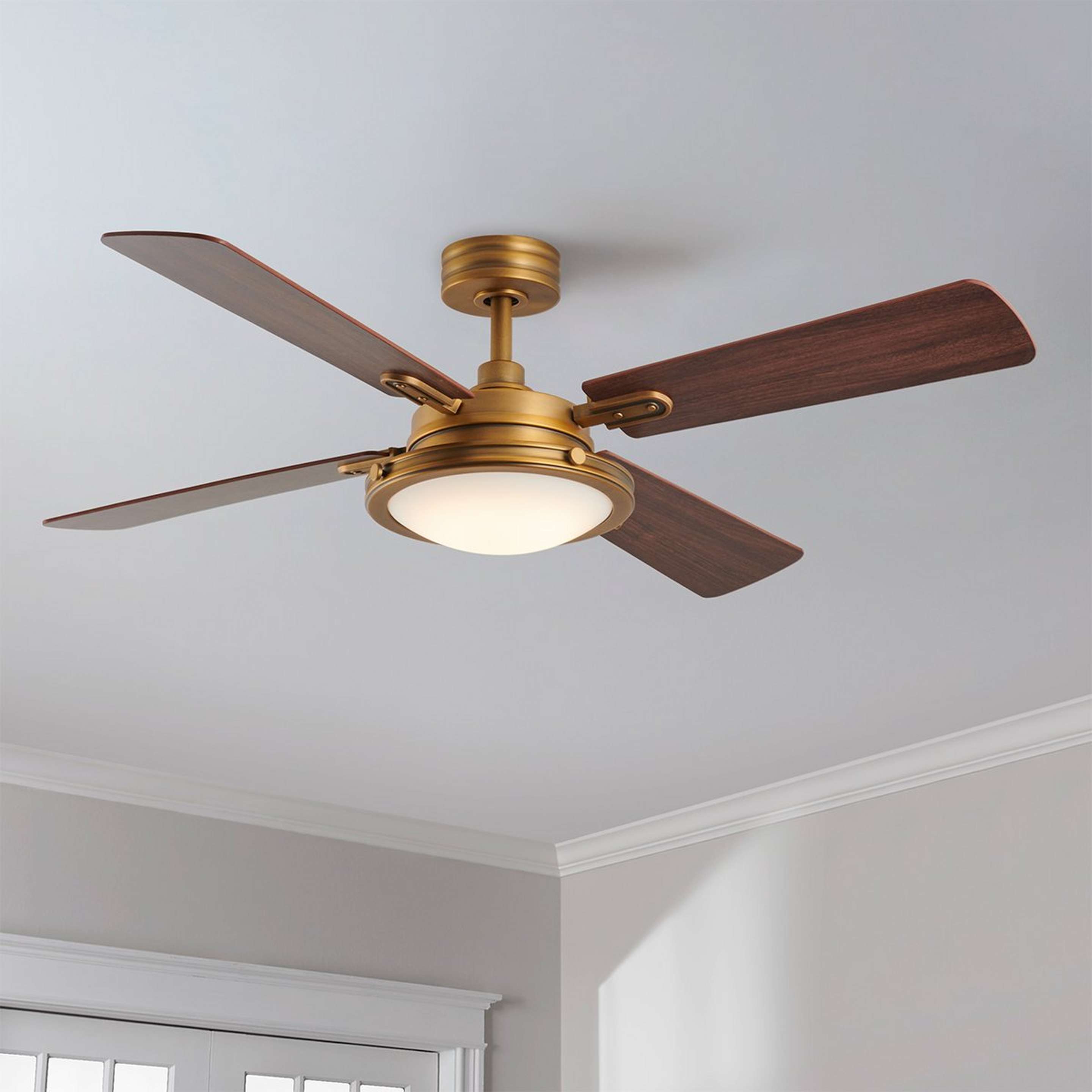A 54" Genevieve LED Ceiling Fan with Aged Brass / Walnut color