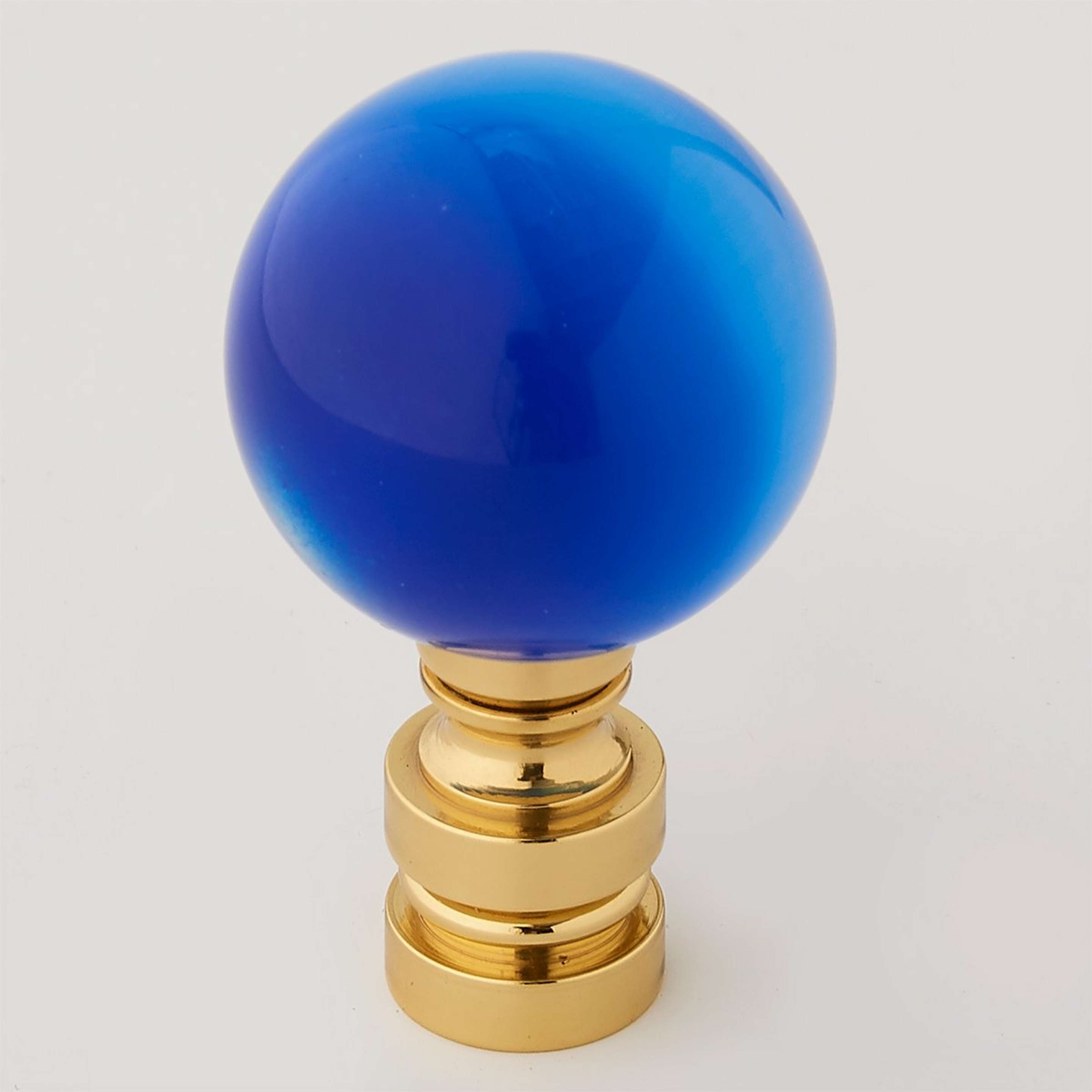 A Blue Glass Cat's Eye 2" with Blue / Brass color
