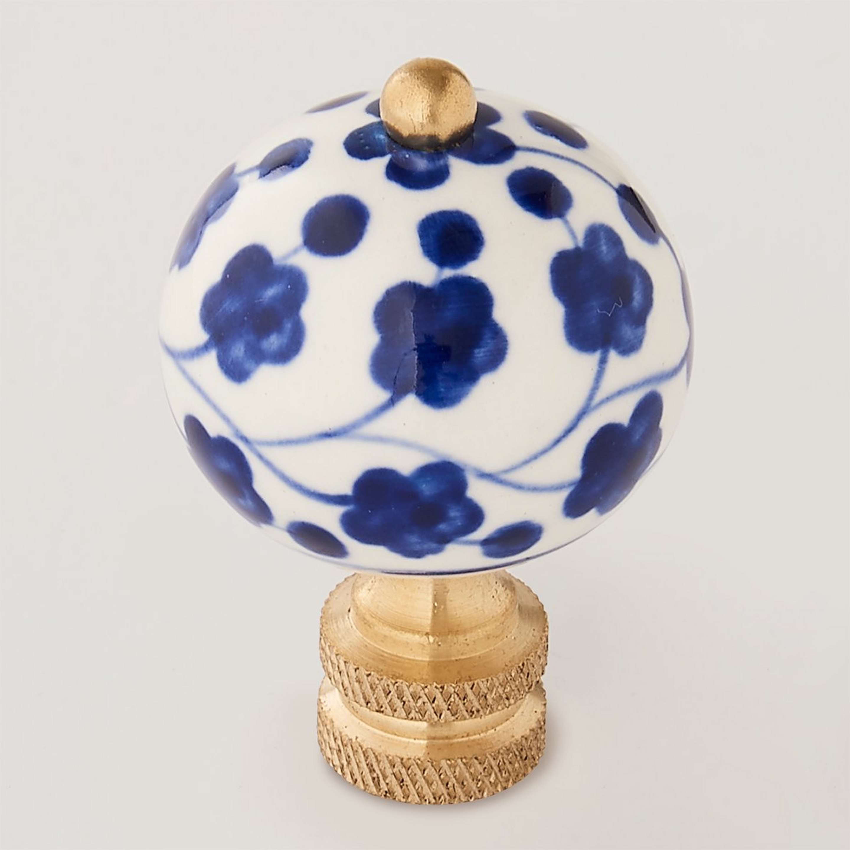 A Floral Porcelain Finial with Blue / White / Brass color