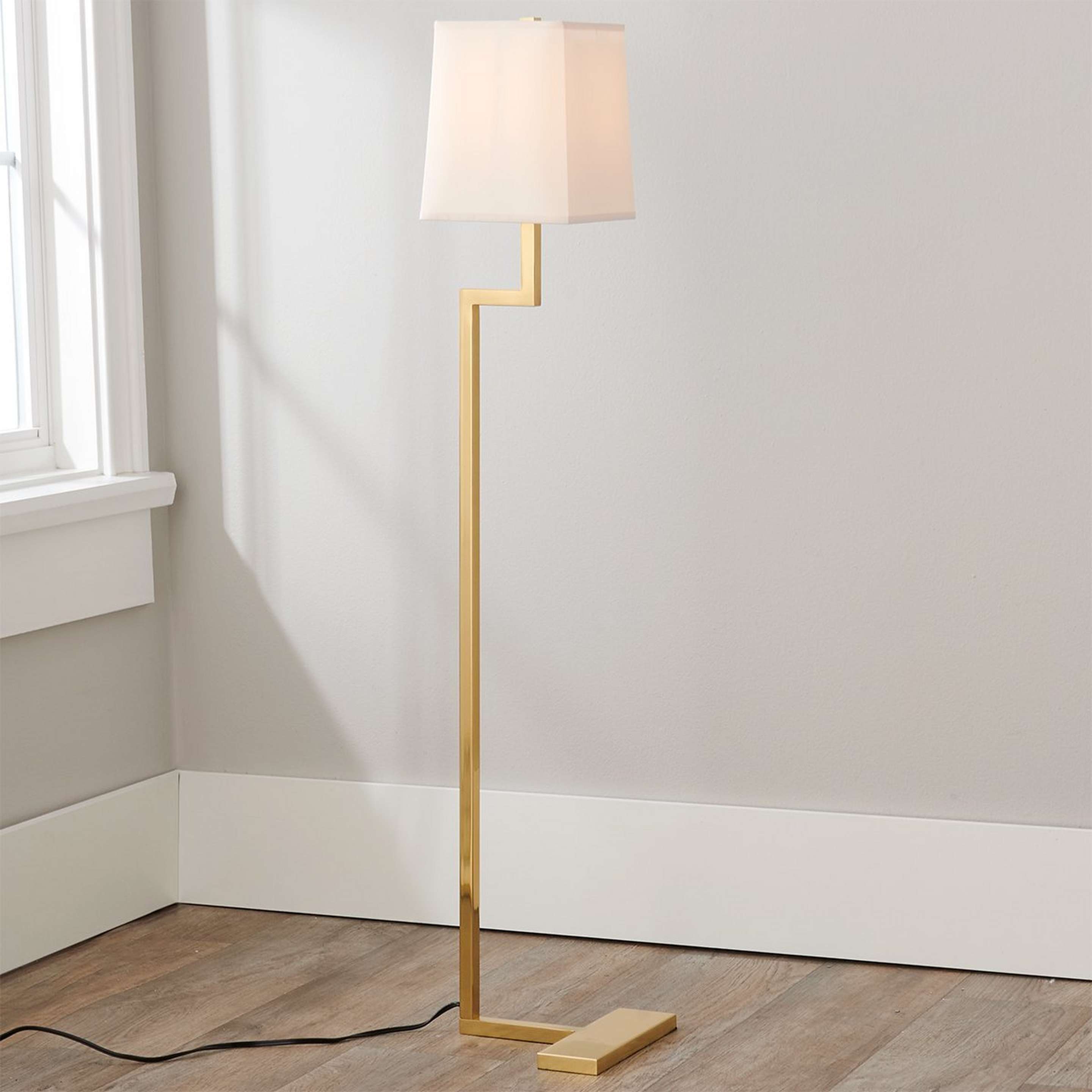 A Times Square Floor Lamp with Polished Brass color