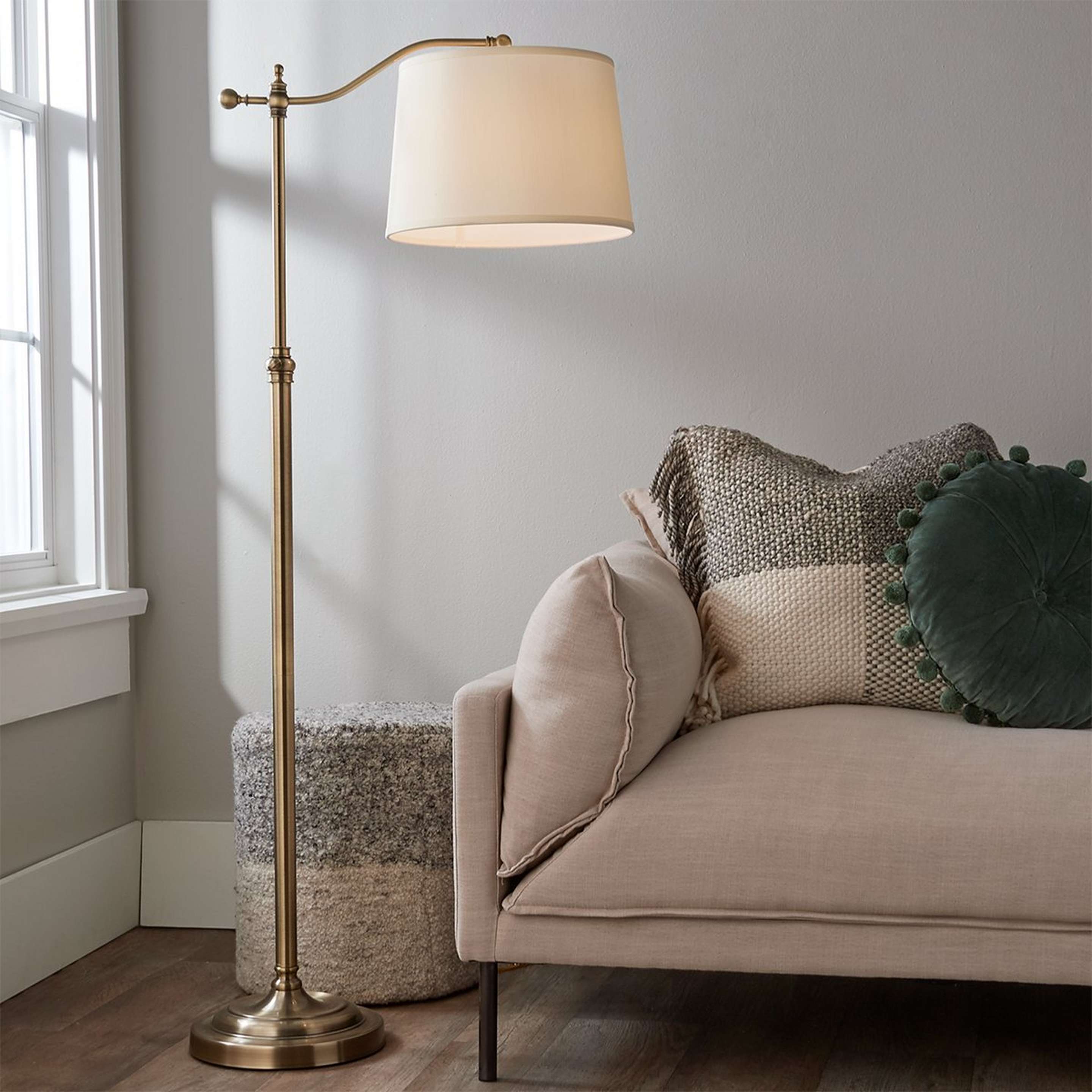 A Arched Bridge Arm Adjustable Floor Lamp with Aged Brass color