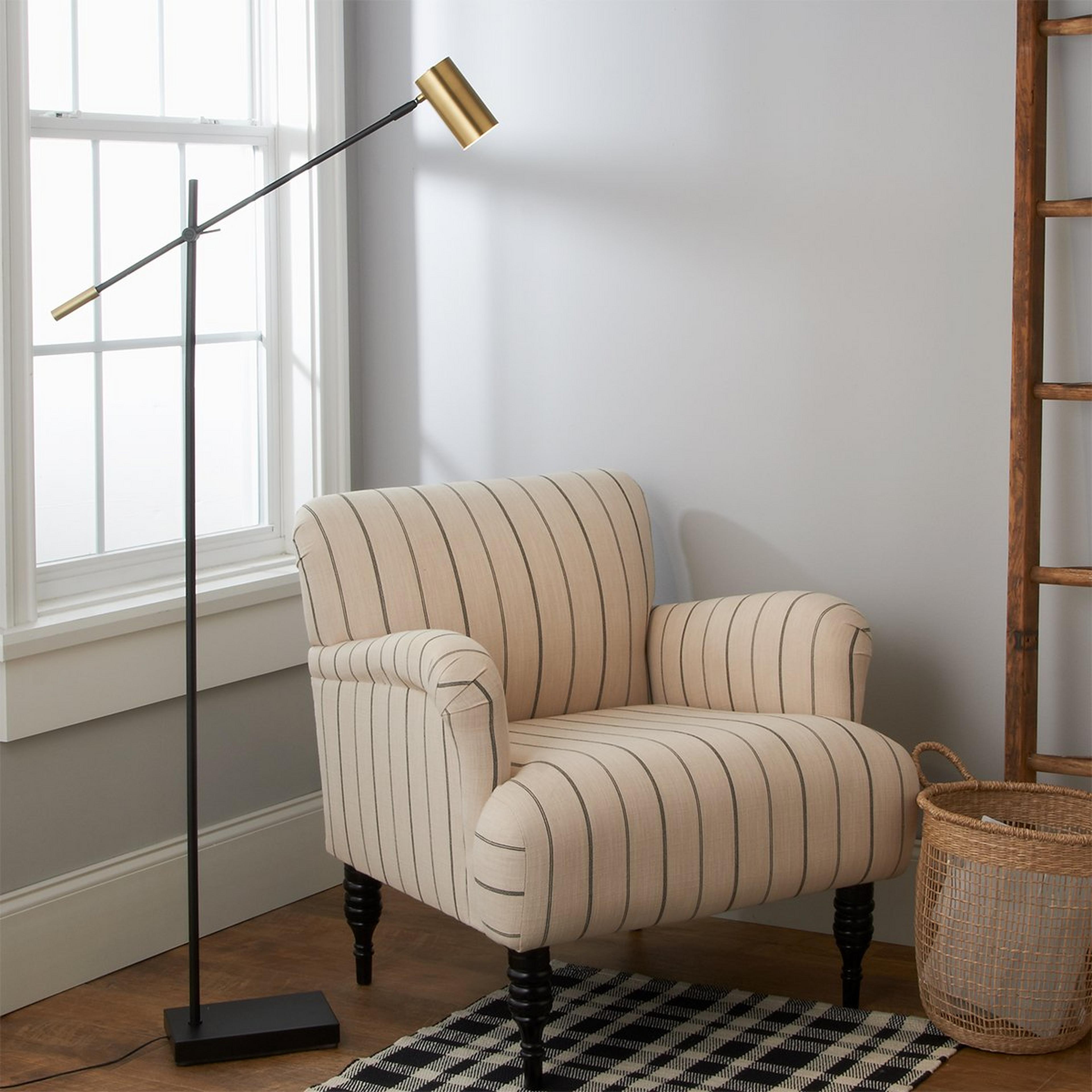 A Balance LED Floor Lamp with Black / Antique Brass color