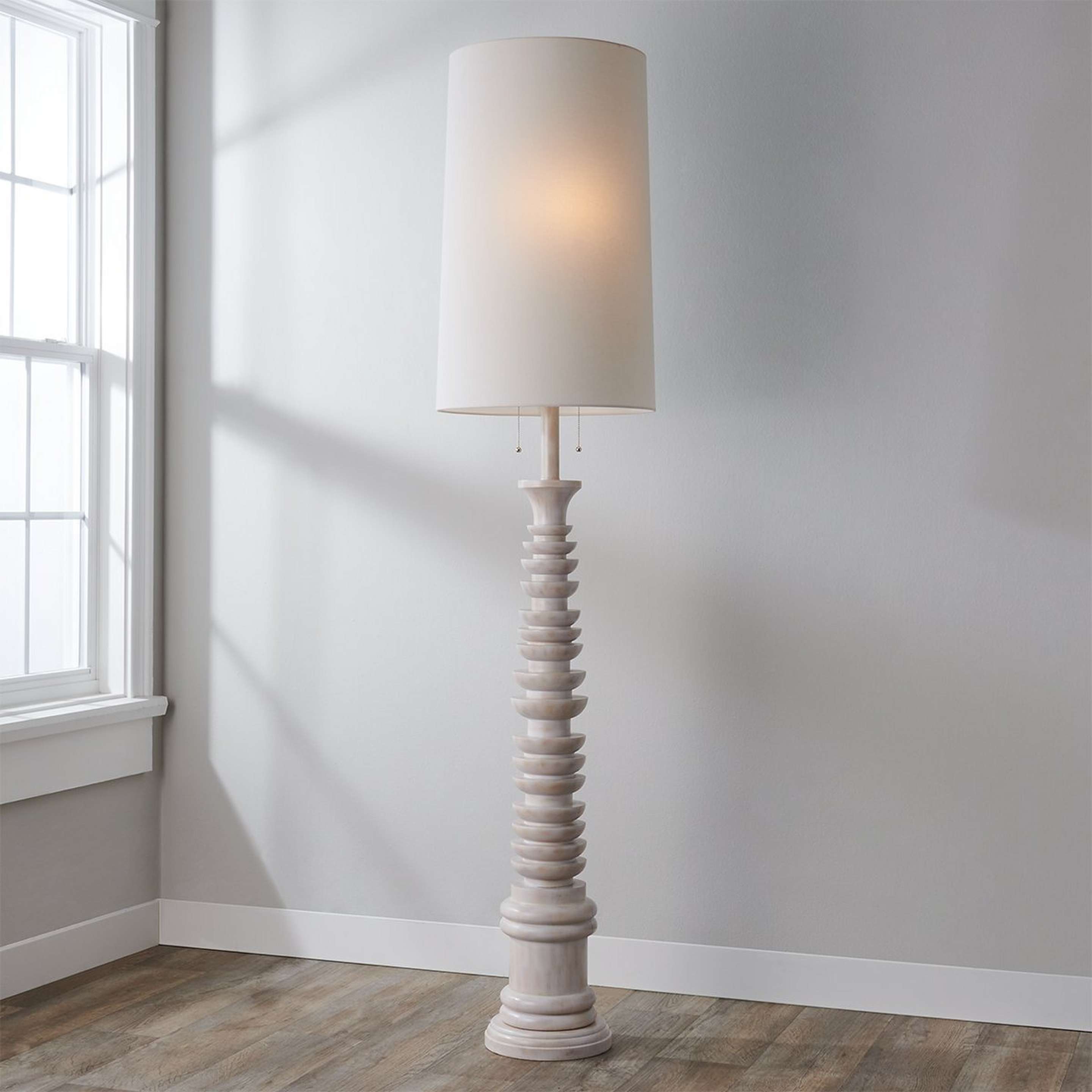 A Andrey Floor Lamp with Whitewashed Wood color