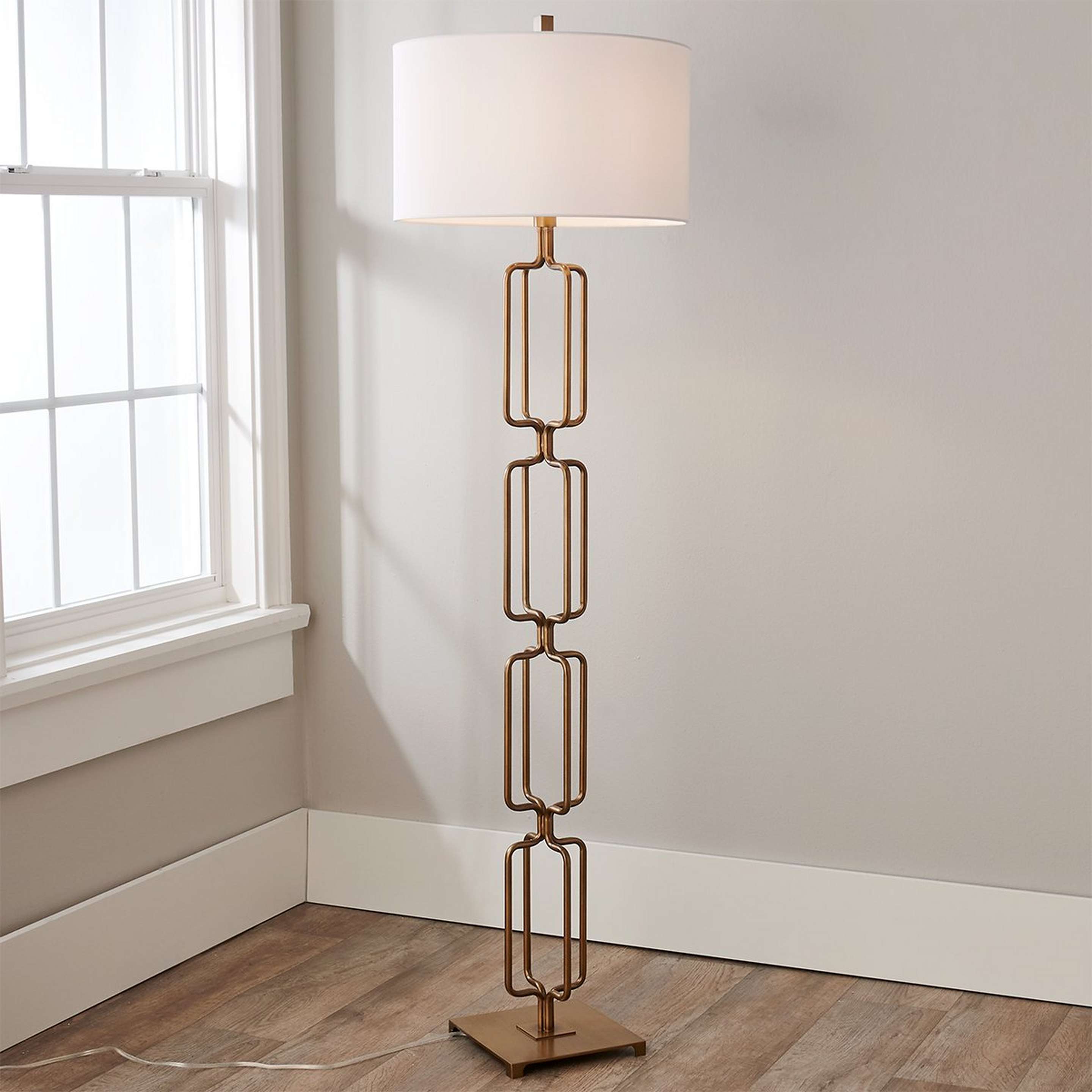 A Escultura Floor Lamp with Antique Gold color